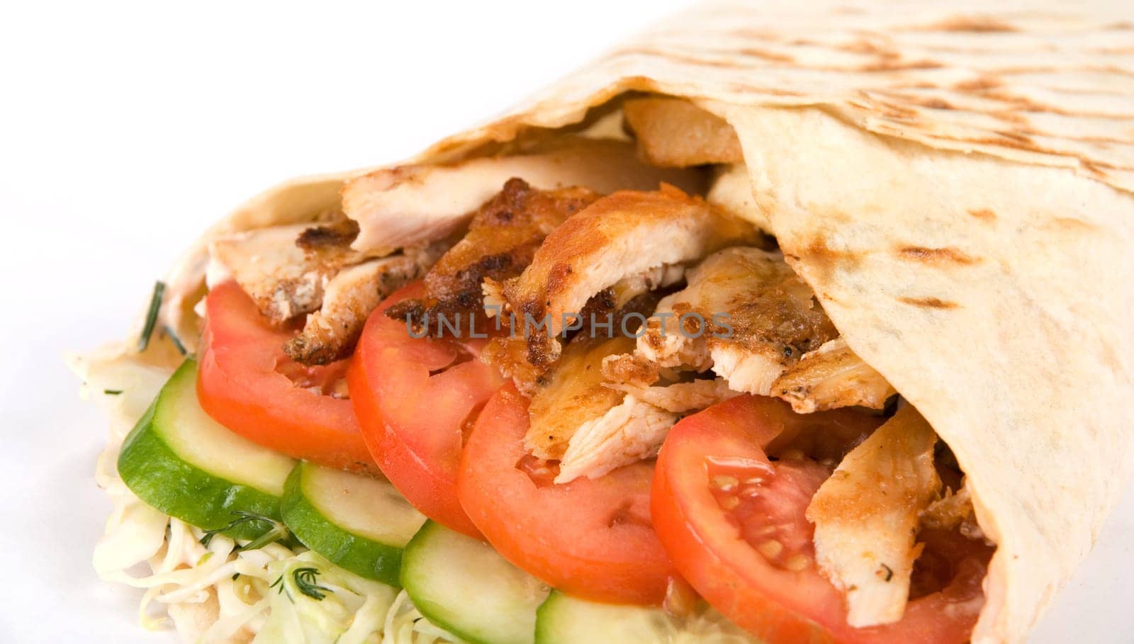 Doner kebab closeup on a white background.