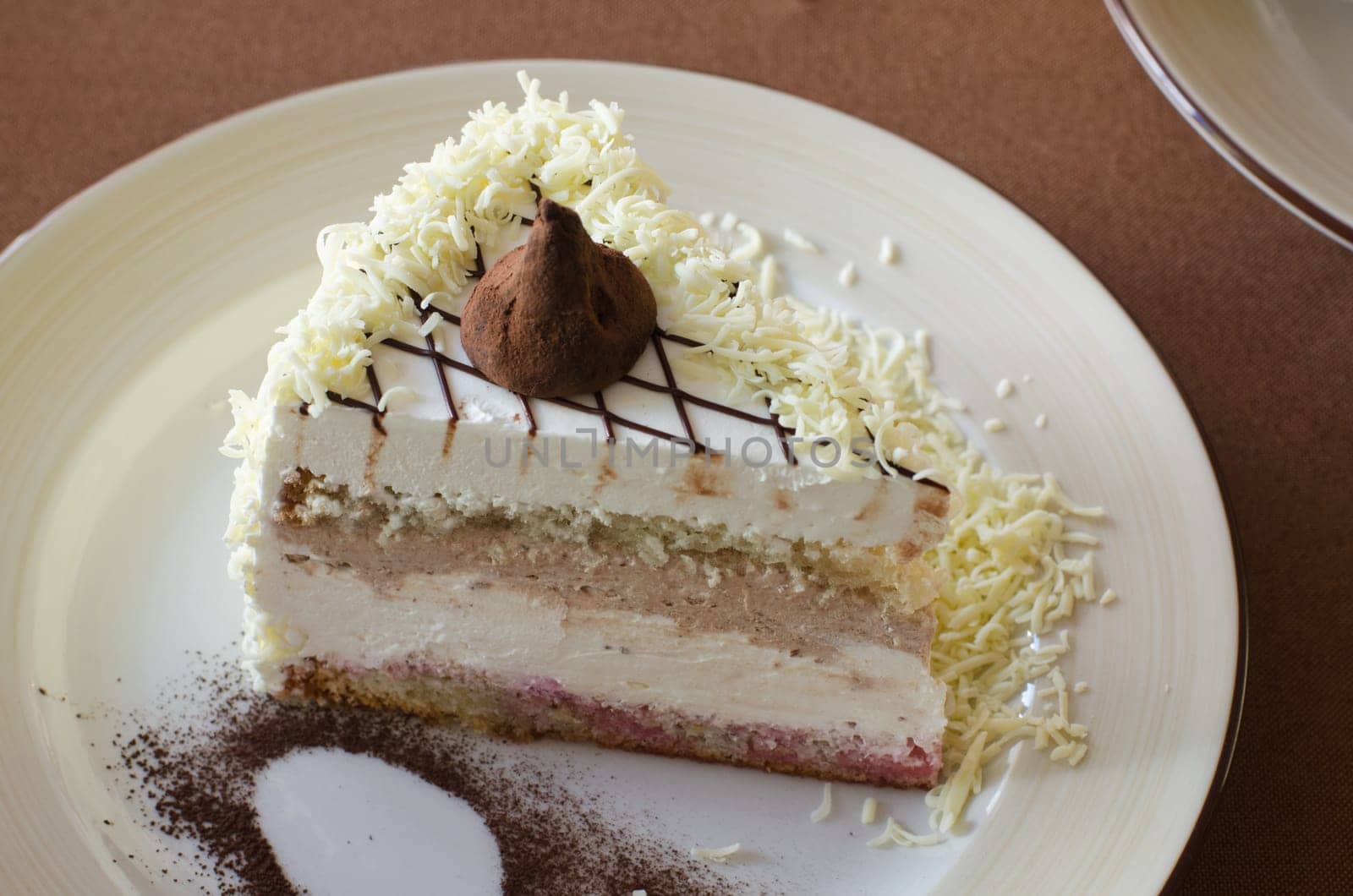 tasty cake at white plate closeup photo