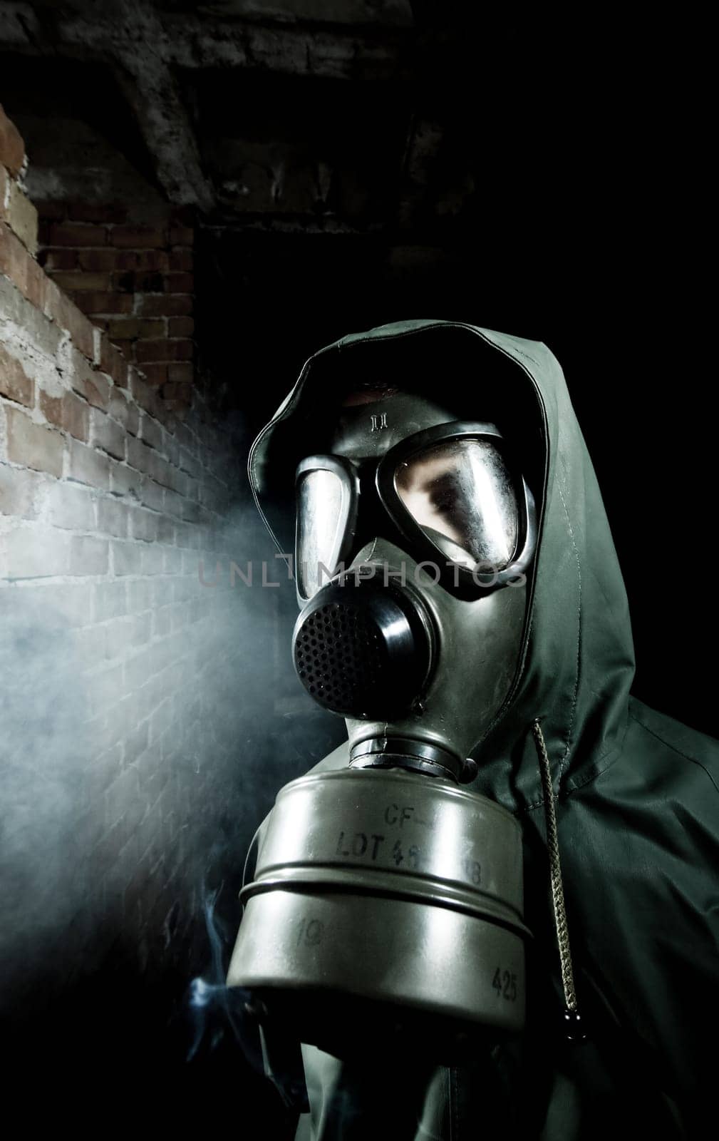 Bizarre portrait of man in gas mask
