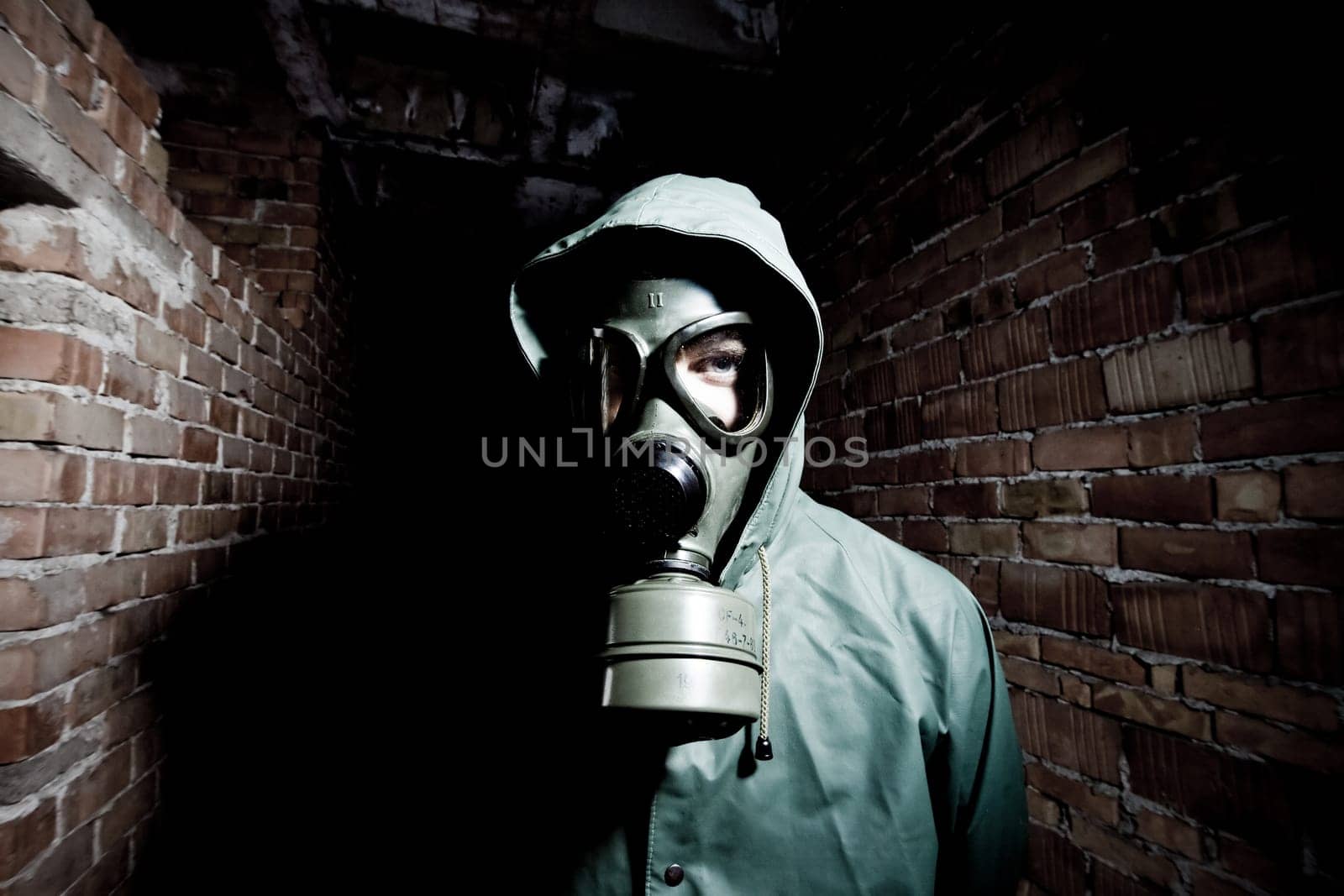 Bizarre portrait of man in gas mask