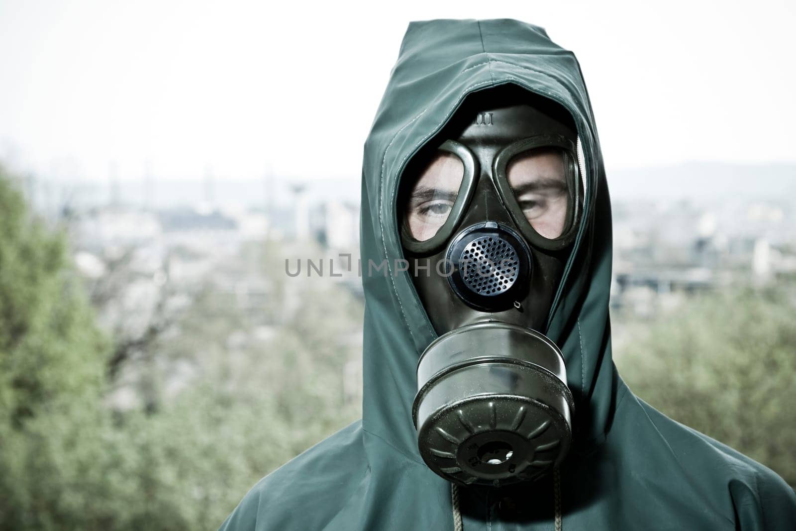 Bizarre portrait of man in gas mask