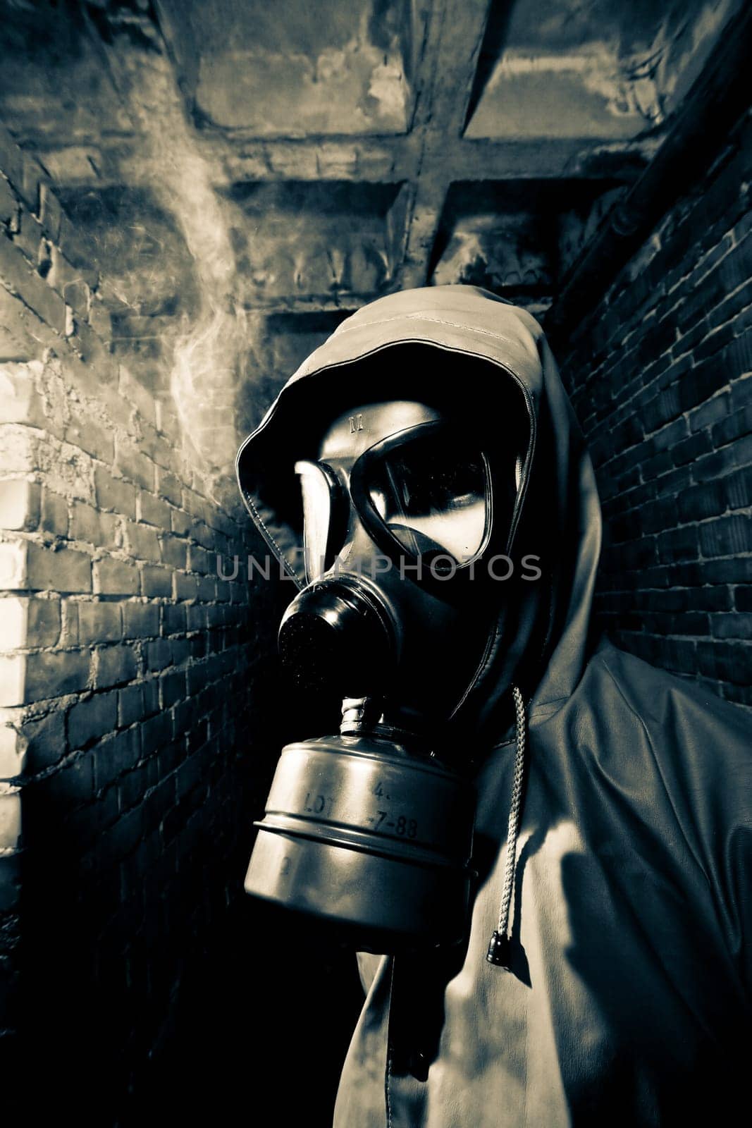 Bizarre portrait of man in gas mask