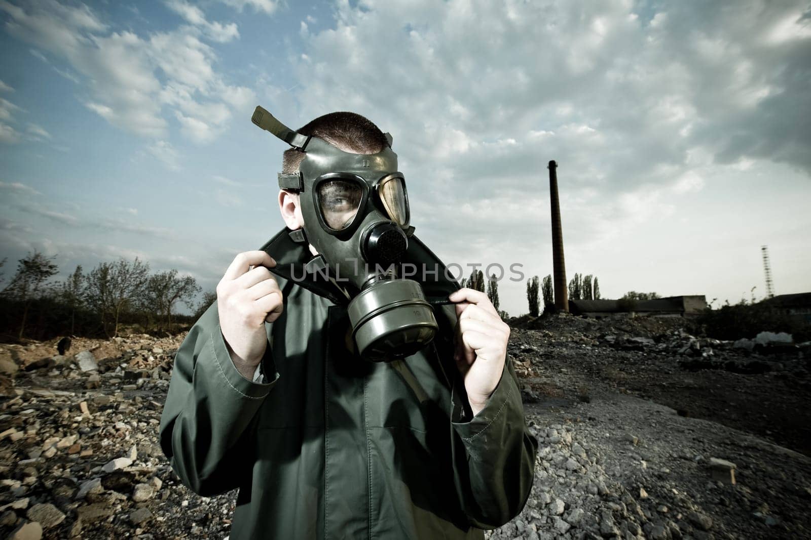 Bizarre portrait of man in gas mask