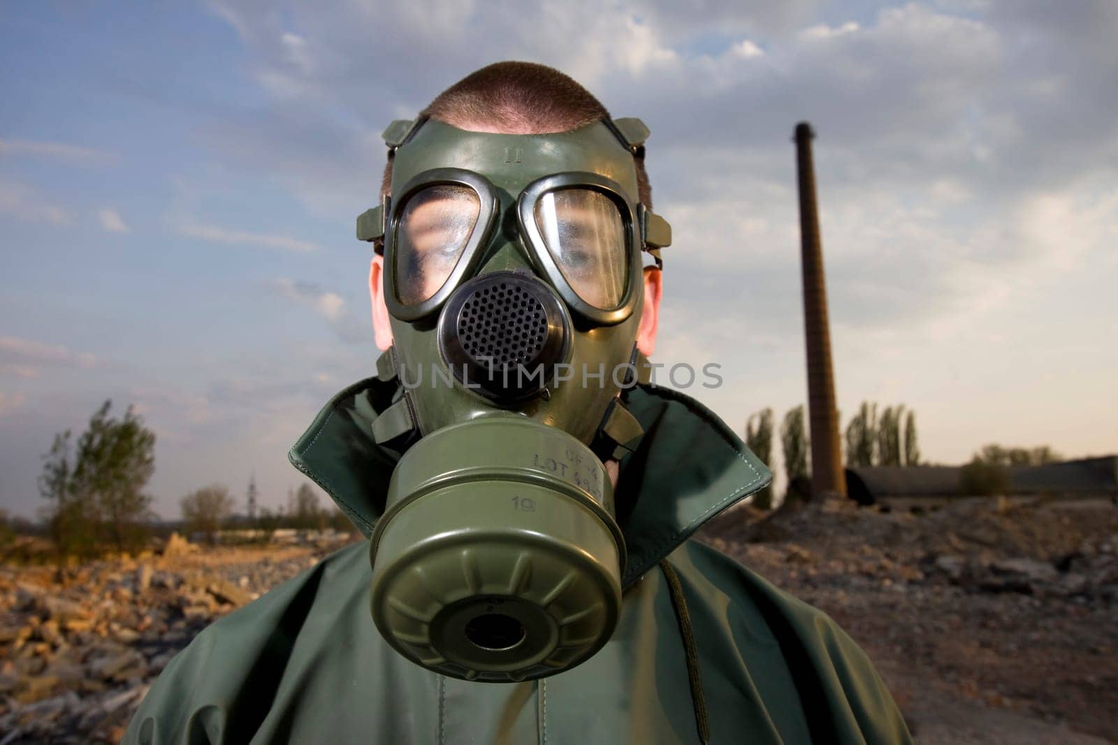 Bizarre portrait of man in gas mask