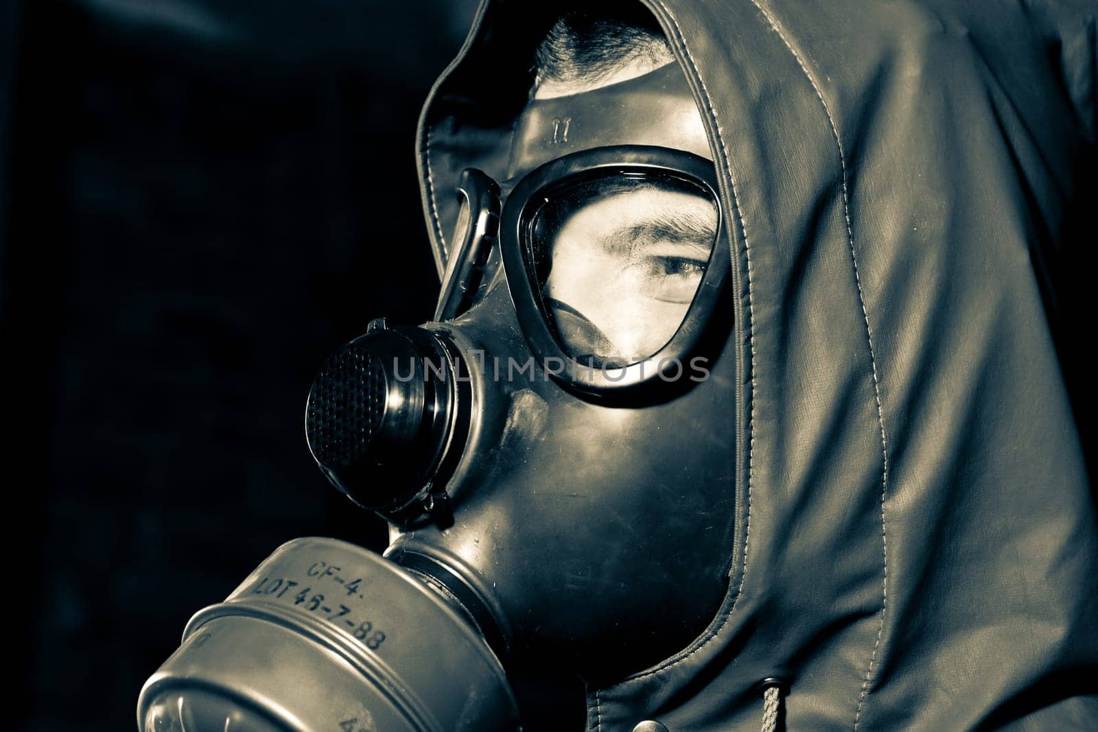 Bizarre portrait of man in gas mask