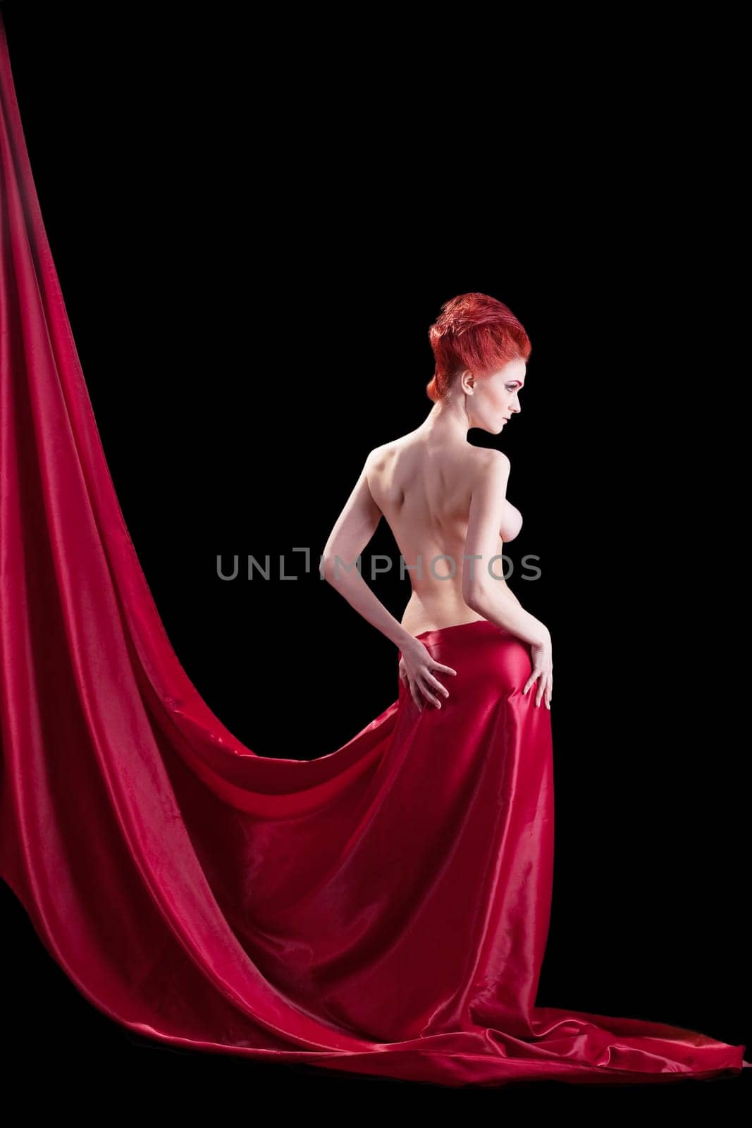 Beautyful young naked red woman in dark