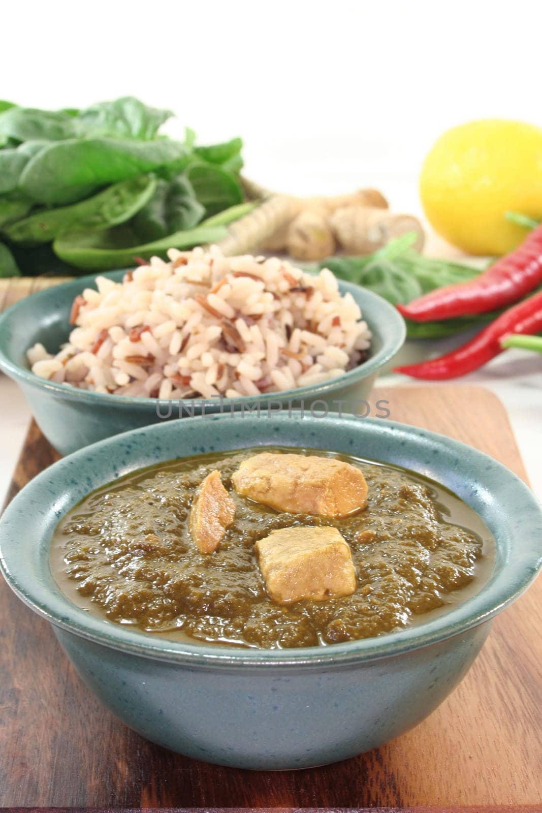 Indian palak paneer with rice and fresh ingredients