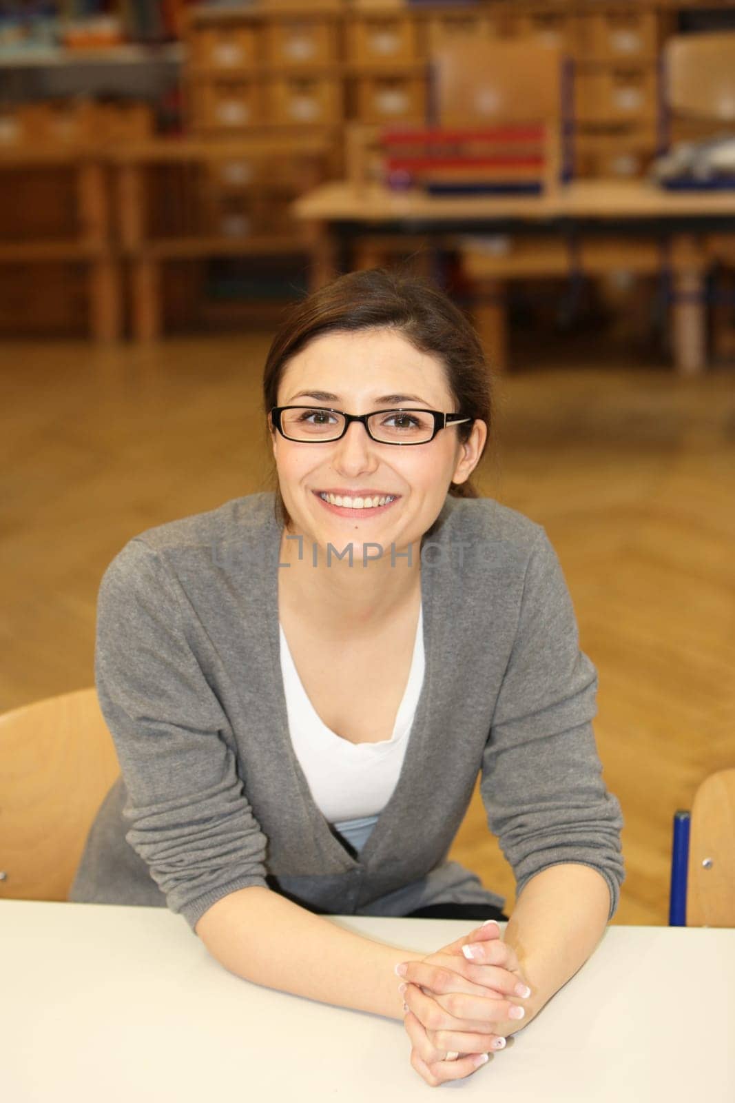 Teacher or student in university laughing at camera