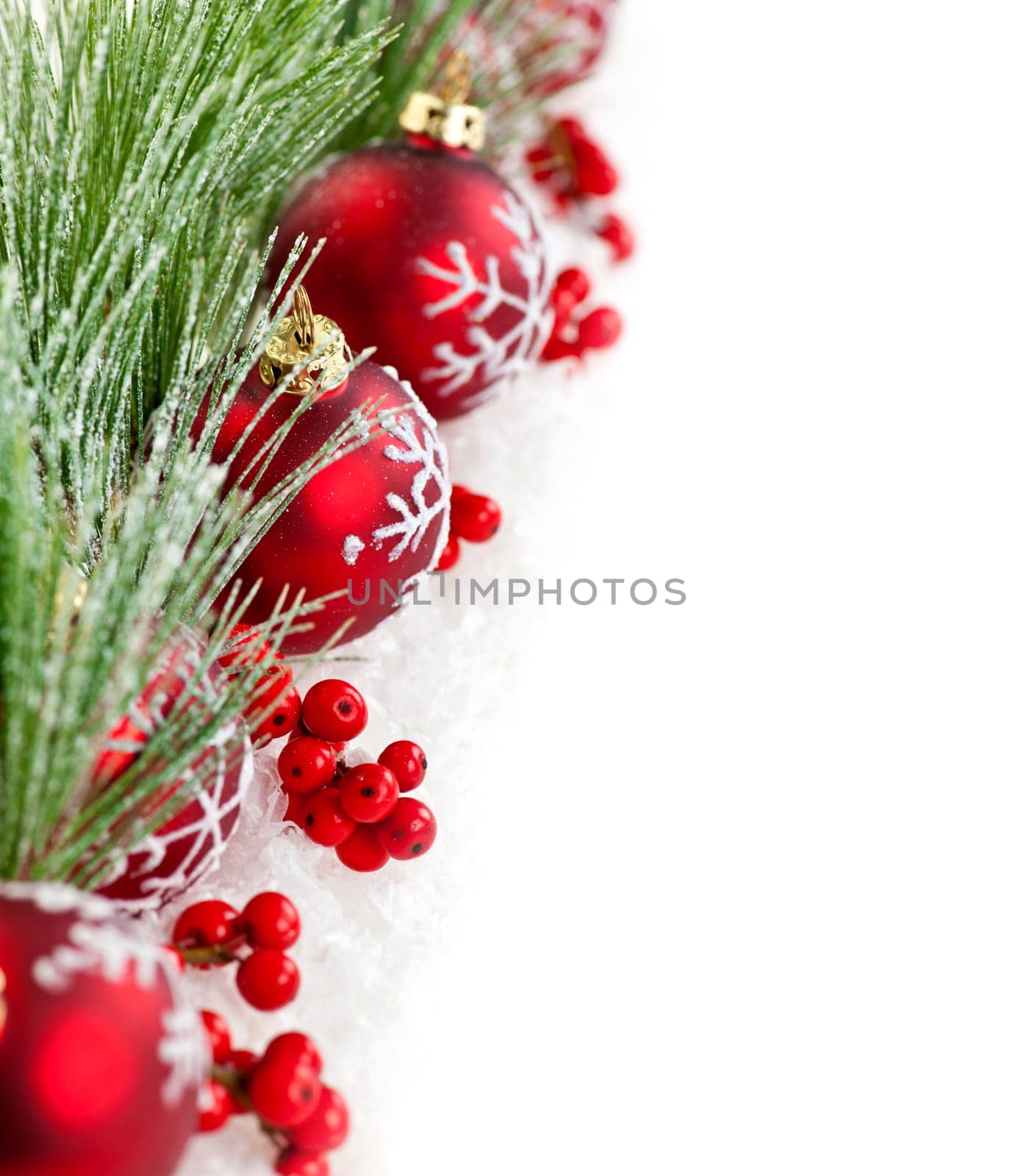 Red Christmas decorations with pine branches with copy space
