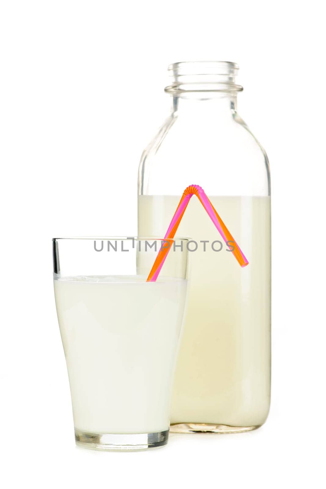Isolated glass and bottle of nutritious white milk with straw