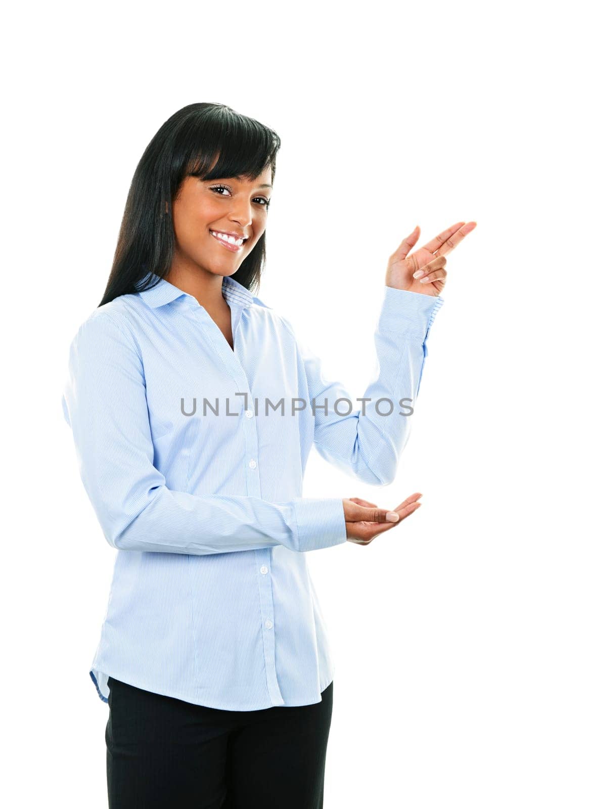 Smiling black woman pointing to the side isolated on white background