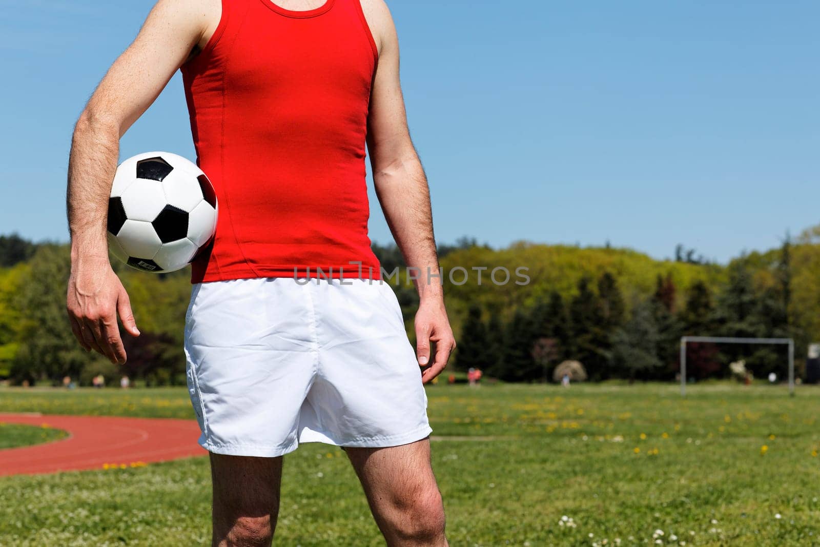 man with a ball in park in summer