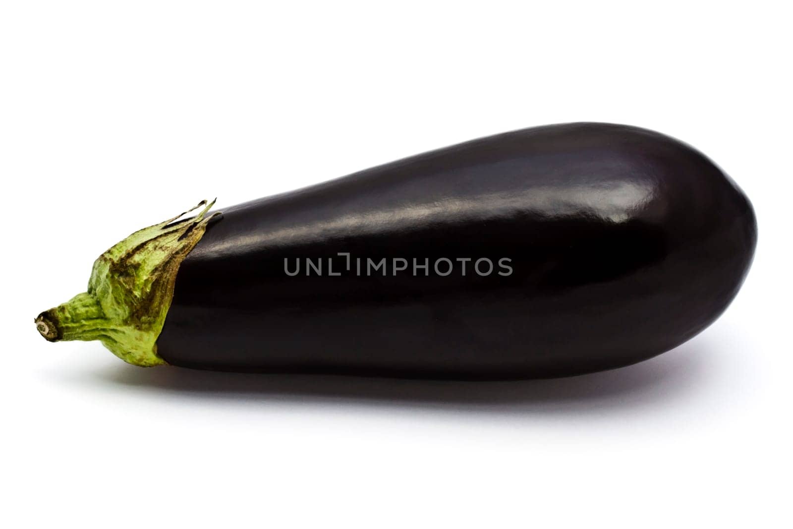 Fresh eggplant closeup on white background
