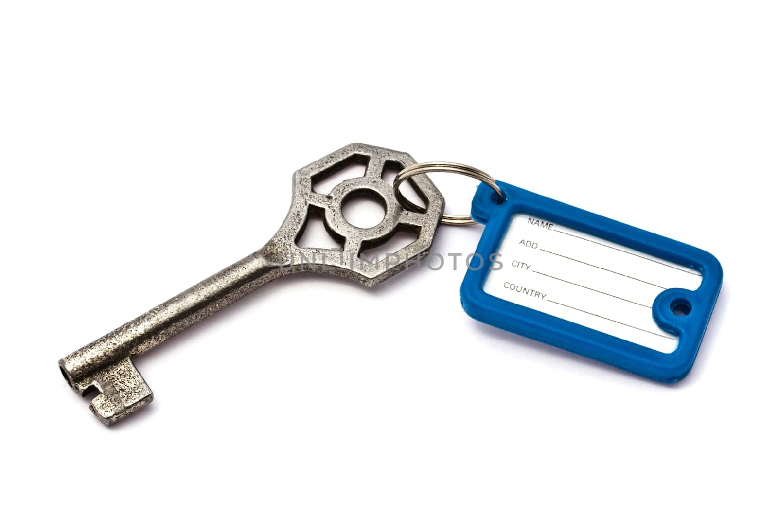 Blank tag and old key isolated on white background