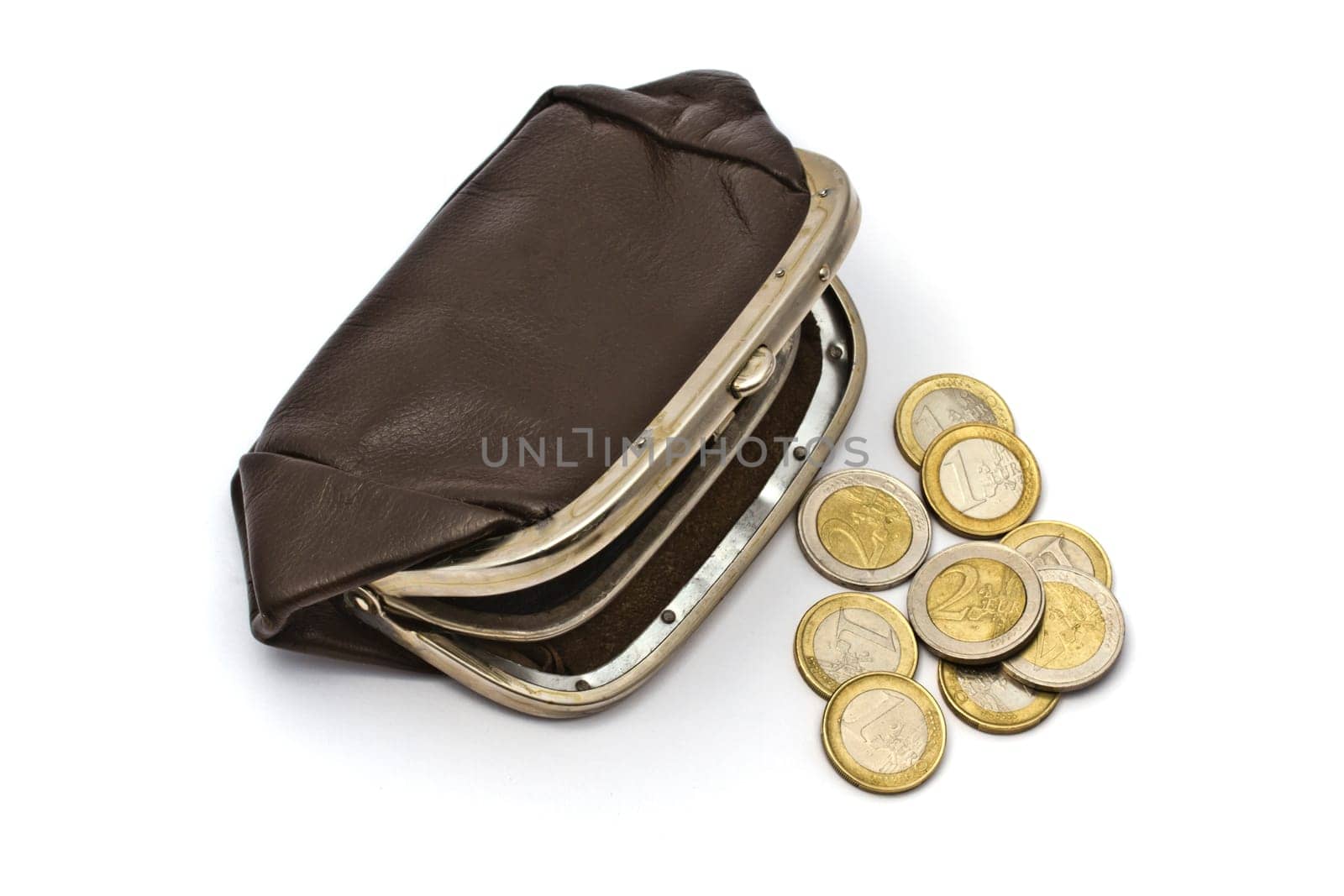 Old purse and euro coins closeup on white background