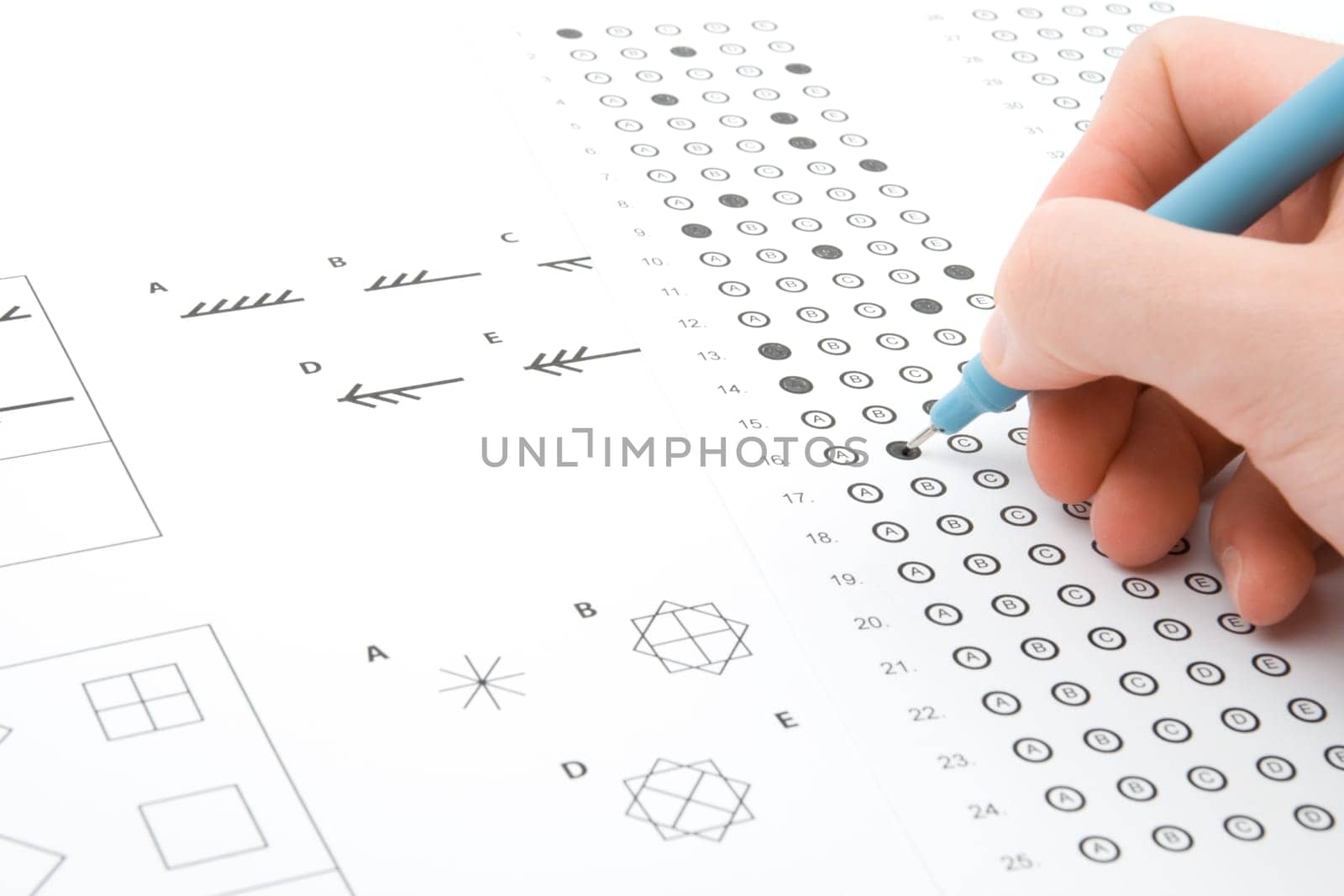 Hand filling IQ test - intelligence measuring concept