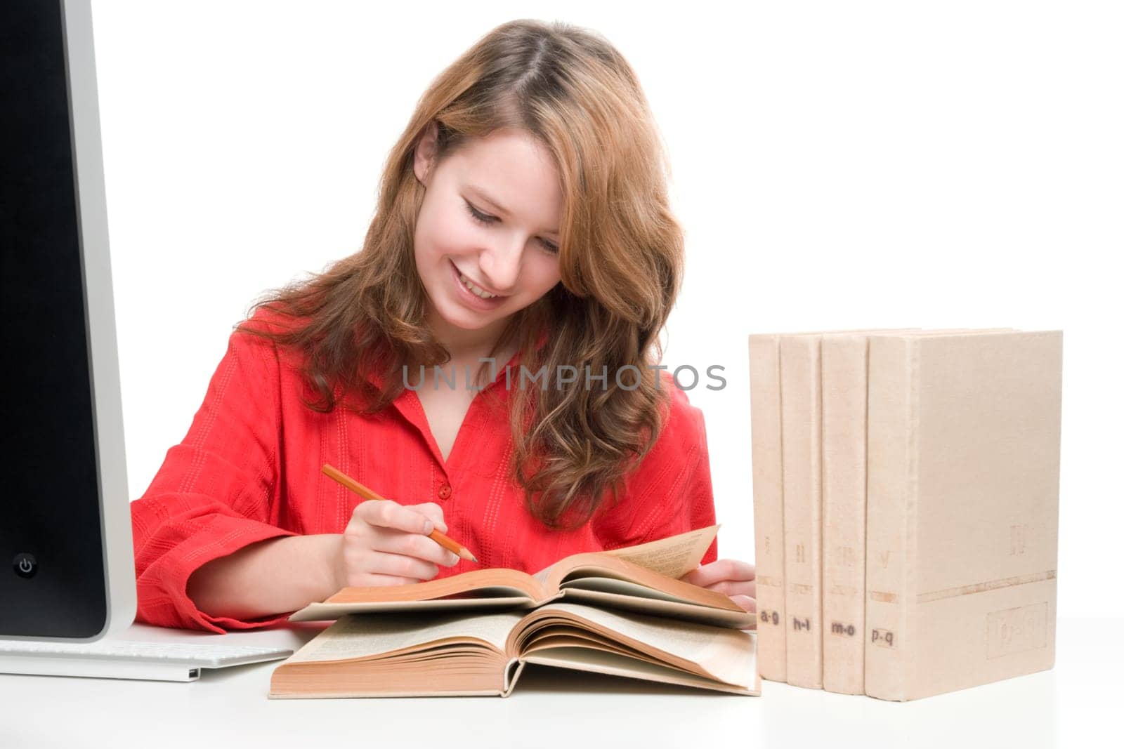Student with computer and books - e-learning concept