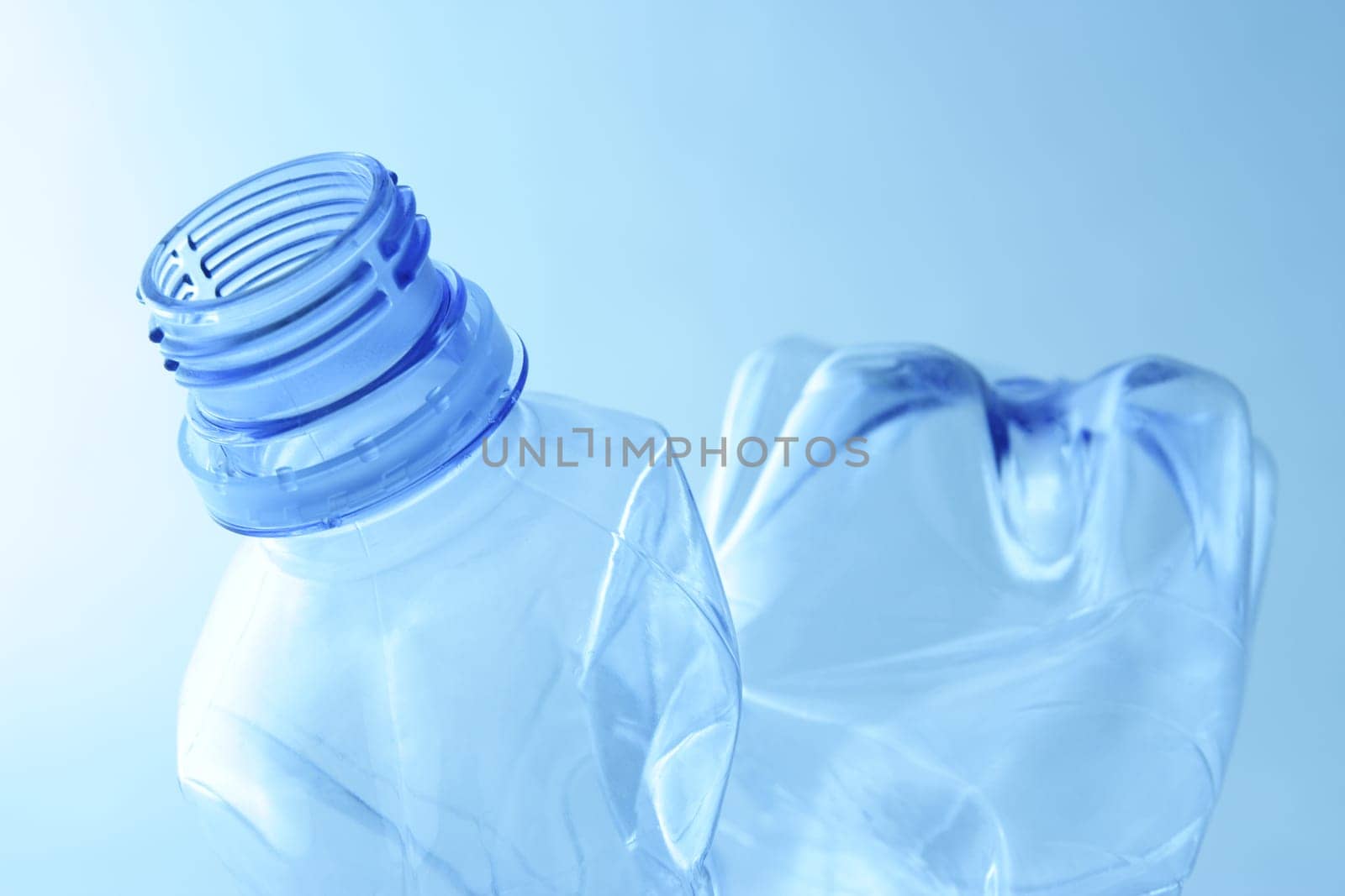 Empty plastic water bottle. Recycle garbage.