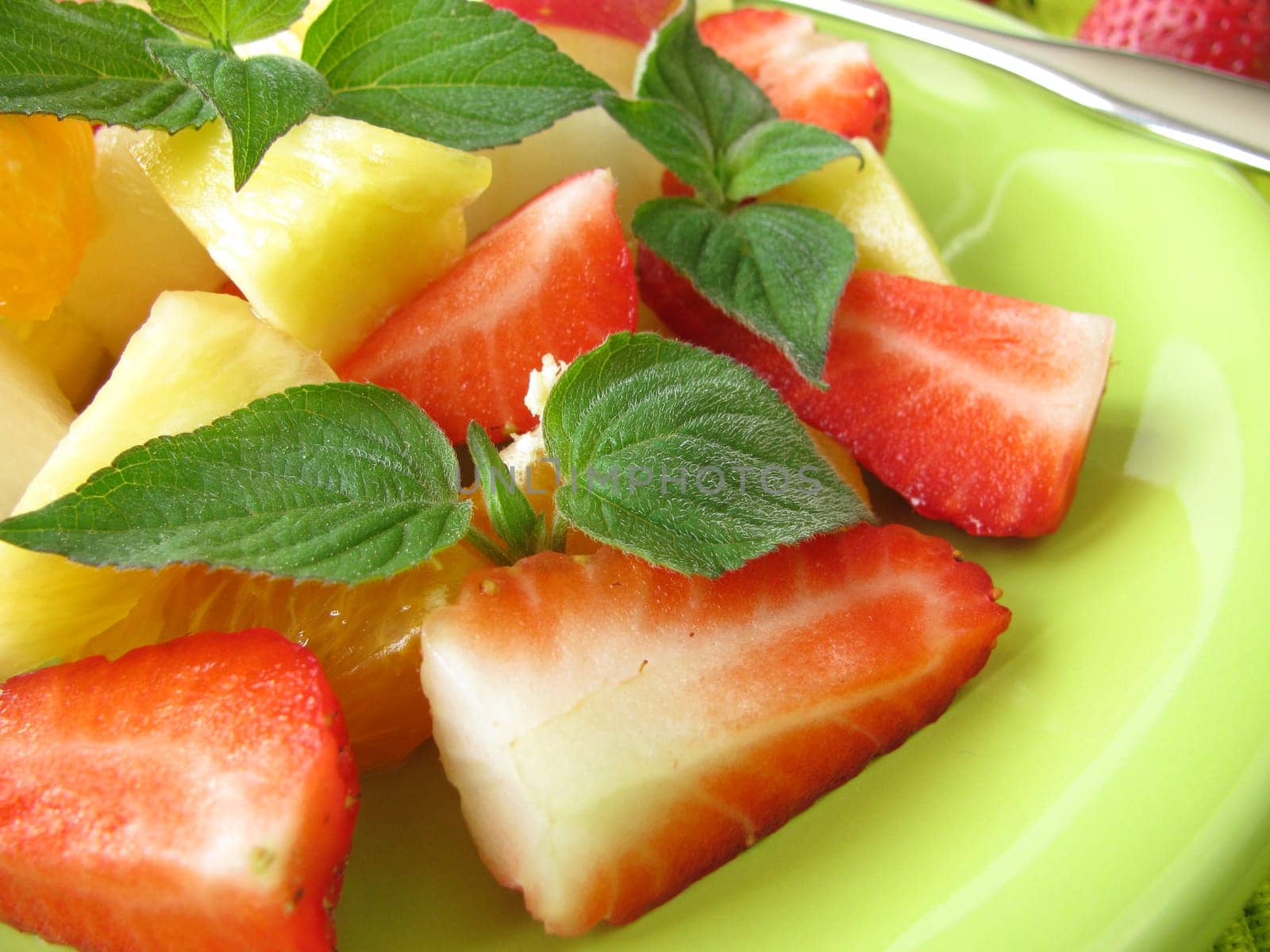 Fruit plate decorated with honeydew melon sage