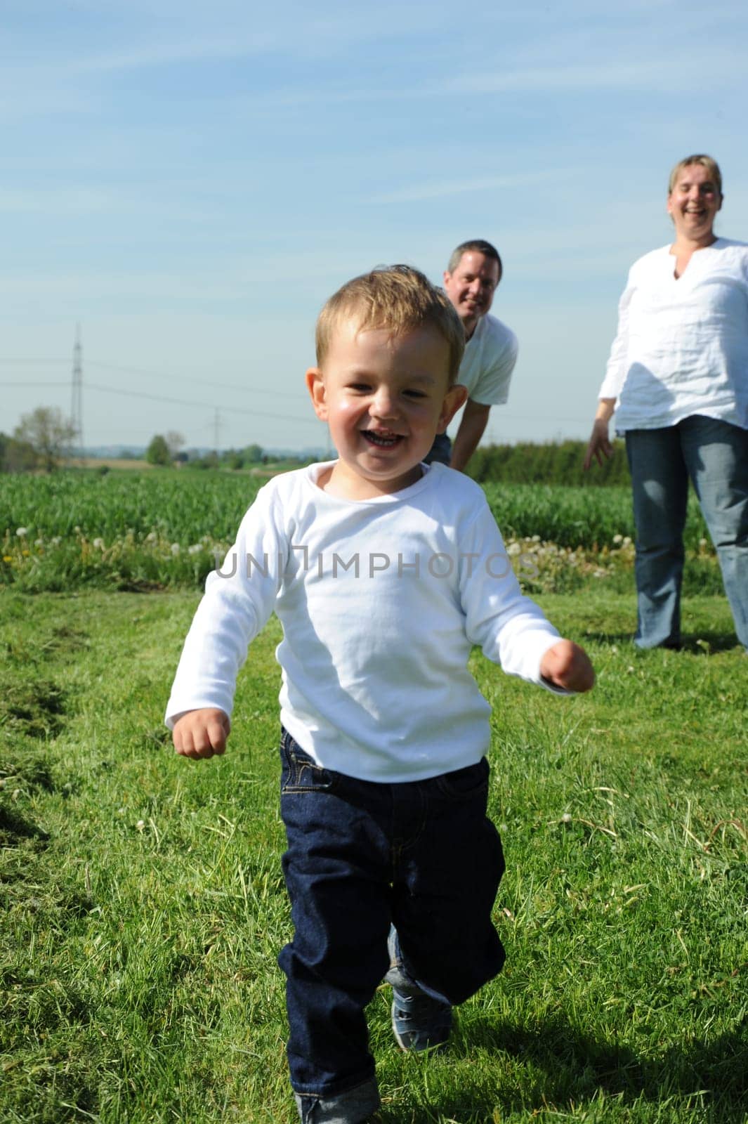 Laughing running little boy