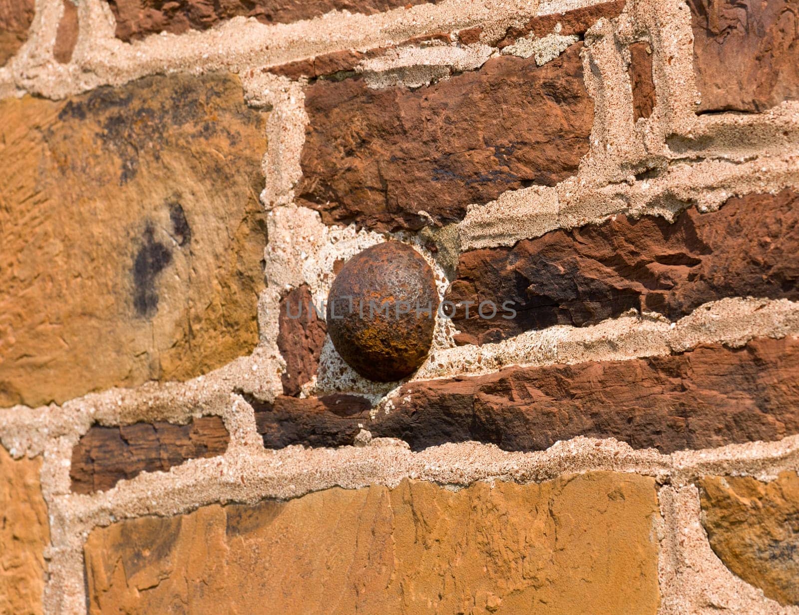 The old stone house in the center of the Manassas Civil War battlefield site near Bull Run showing a cannon ball embedded in the wall