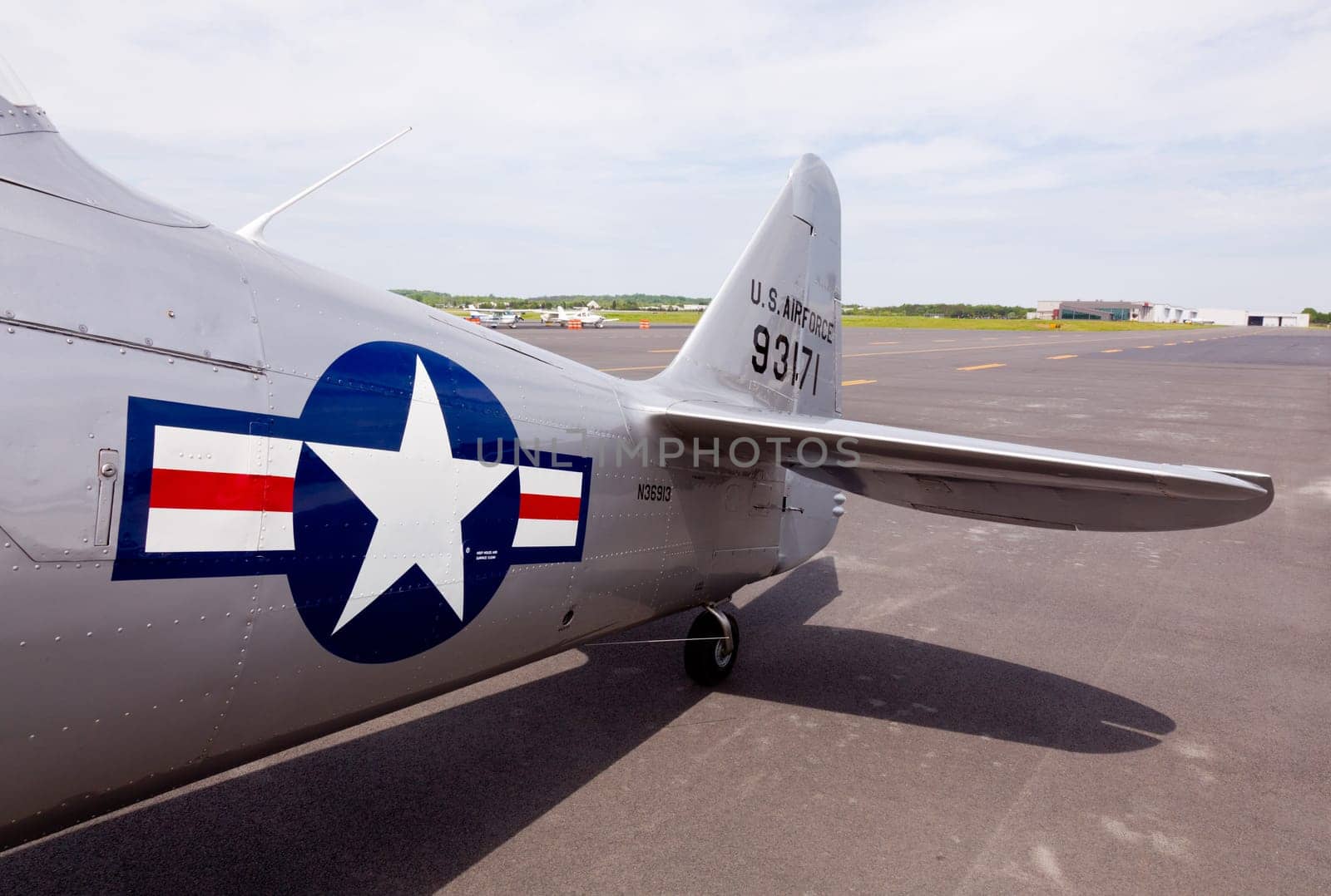 AT-6 Texan, known as the Harvard training plane on runway