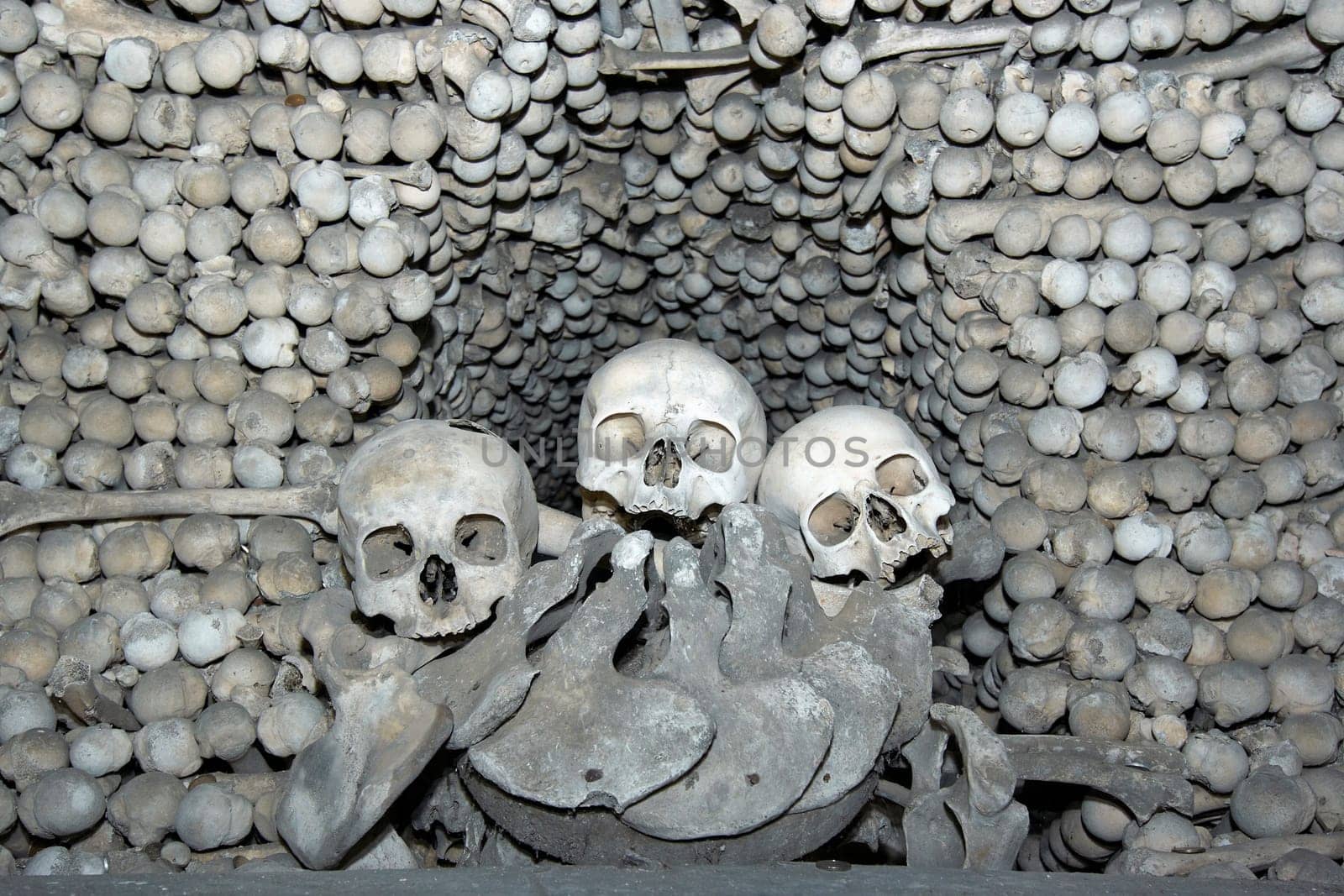 The Sedlec Ossuary is a small Roman Catholic chapel, located beneath the Cemetery Church of All Saints in Sedlec, a suburb of Kutna Hora in the Czech Republic. The ossuary is estimated to contain the skeletons of between 40 000 and 70 000 people.