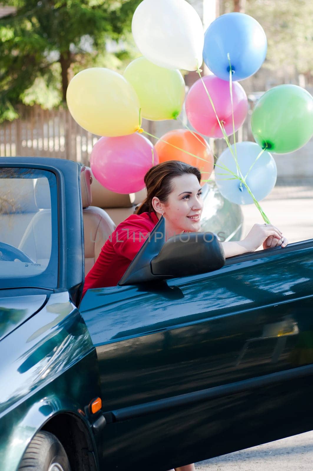 Shot of beautiful brunette woman in car