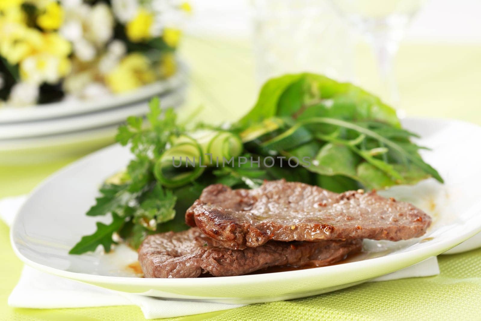 Beef steak with mixed green salad