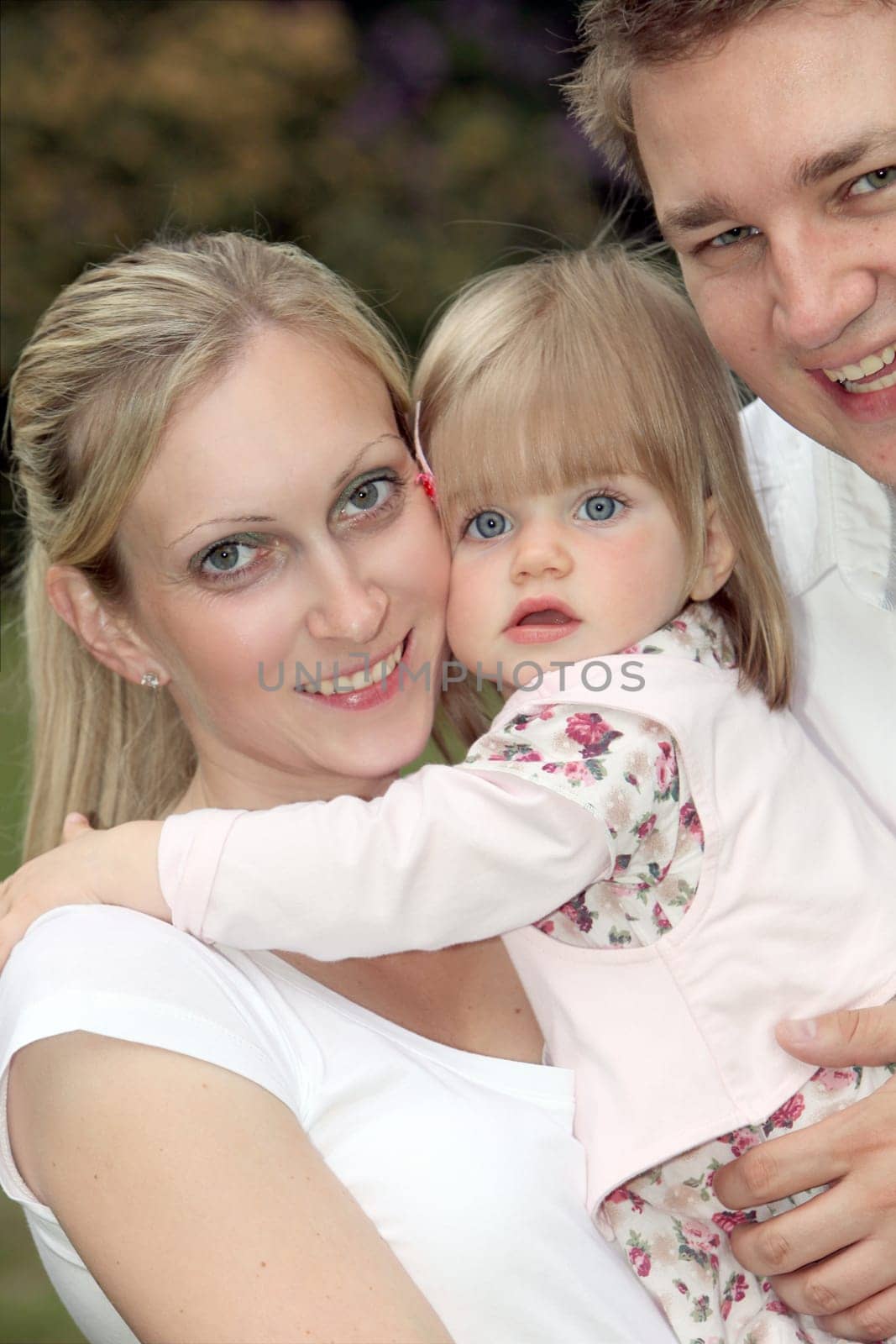 Young happy family with child - portrait