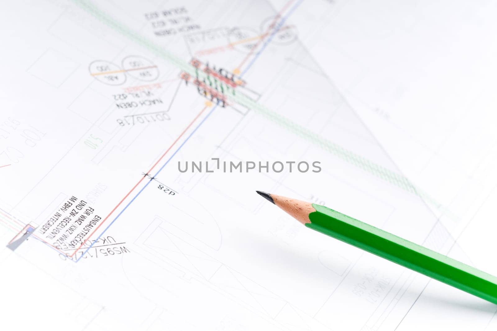 Detail of an industrial plan with green pencil in studio