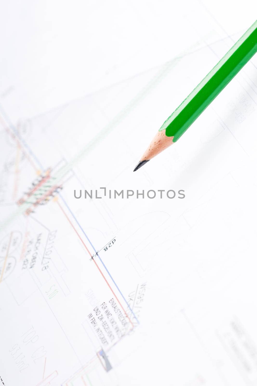 Detail of an industrial plan with green pencil in studio