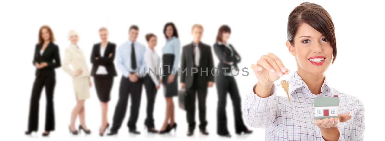 Young businesswoman  (real estate agent) with hose model and keys