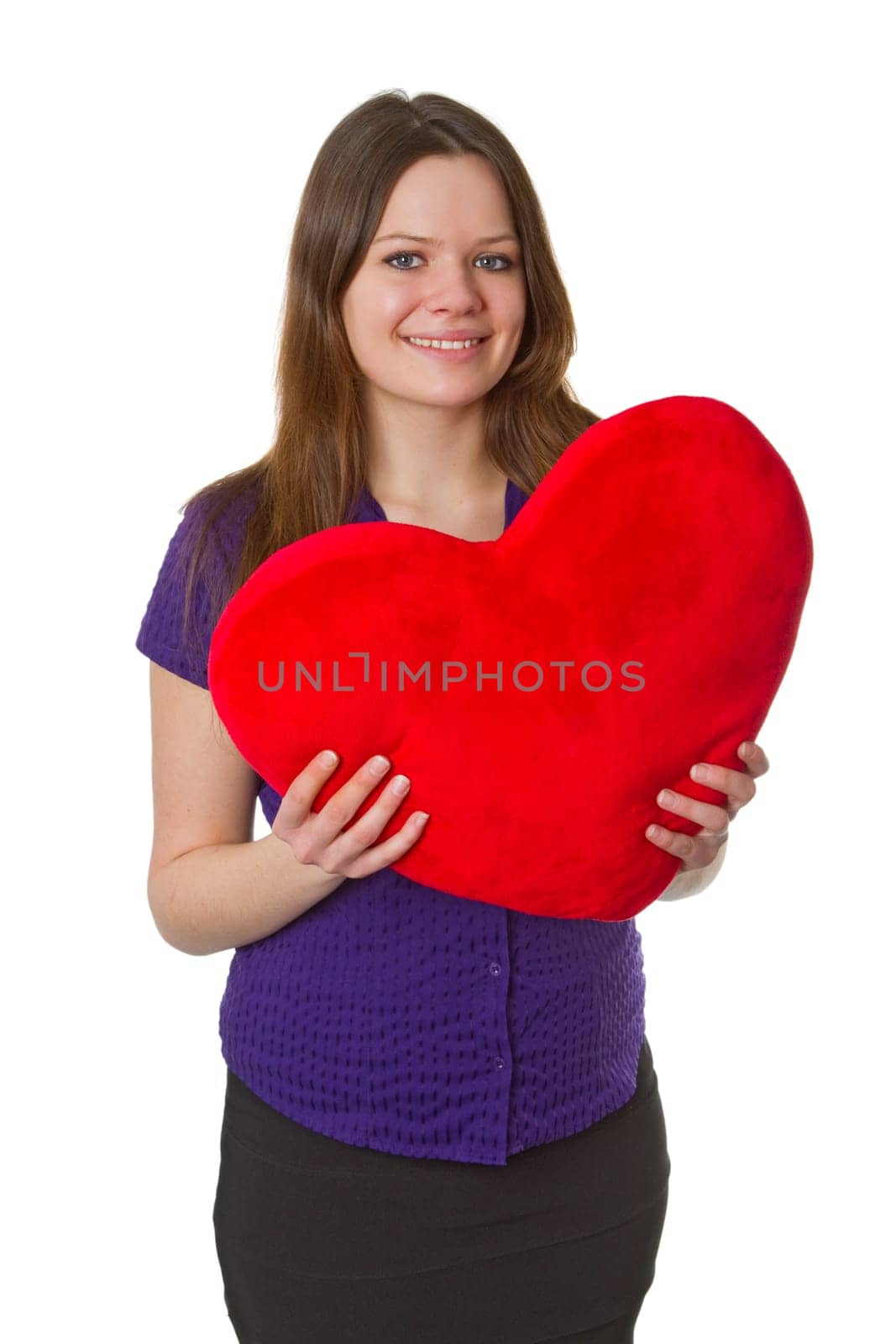 Friendly young woman with heart - isolated on white background