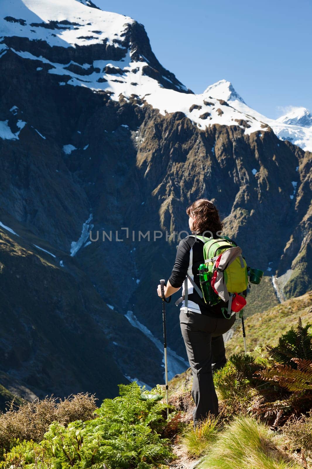 Woman hiker looking out at the mountain tops in New Zealand
