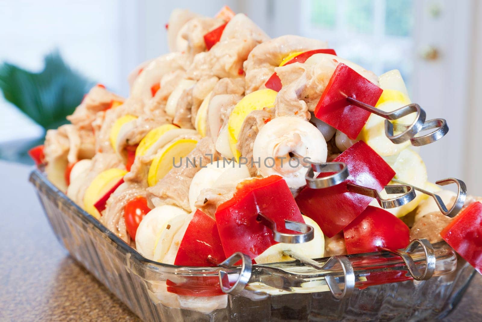 A stack of marinated kabobs ready for grilling