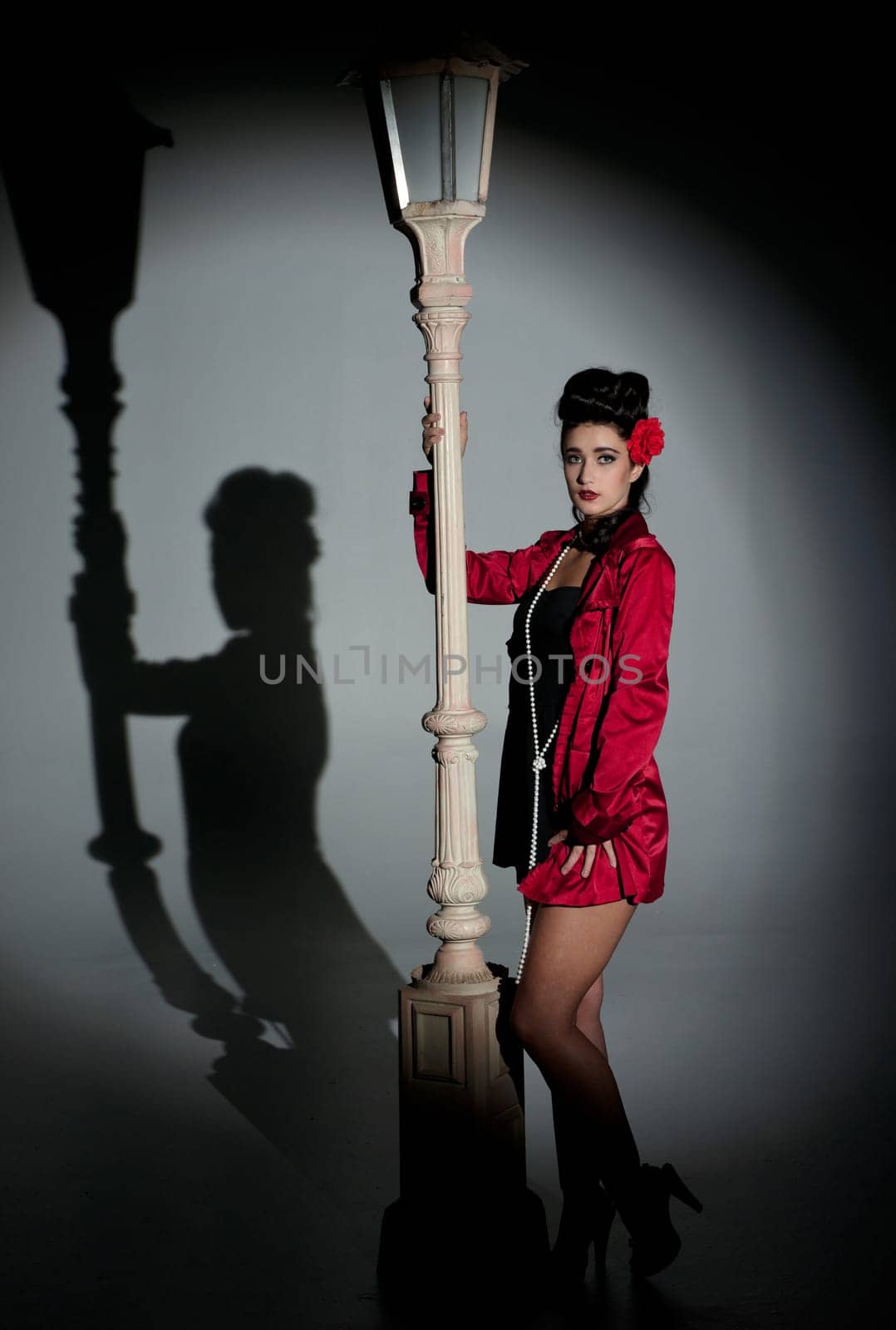 beautiful young glamorous woman  with lightpole