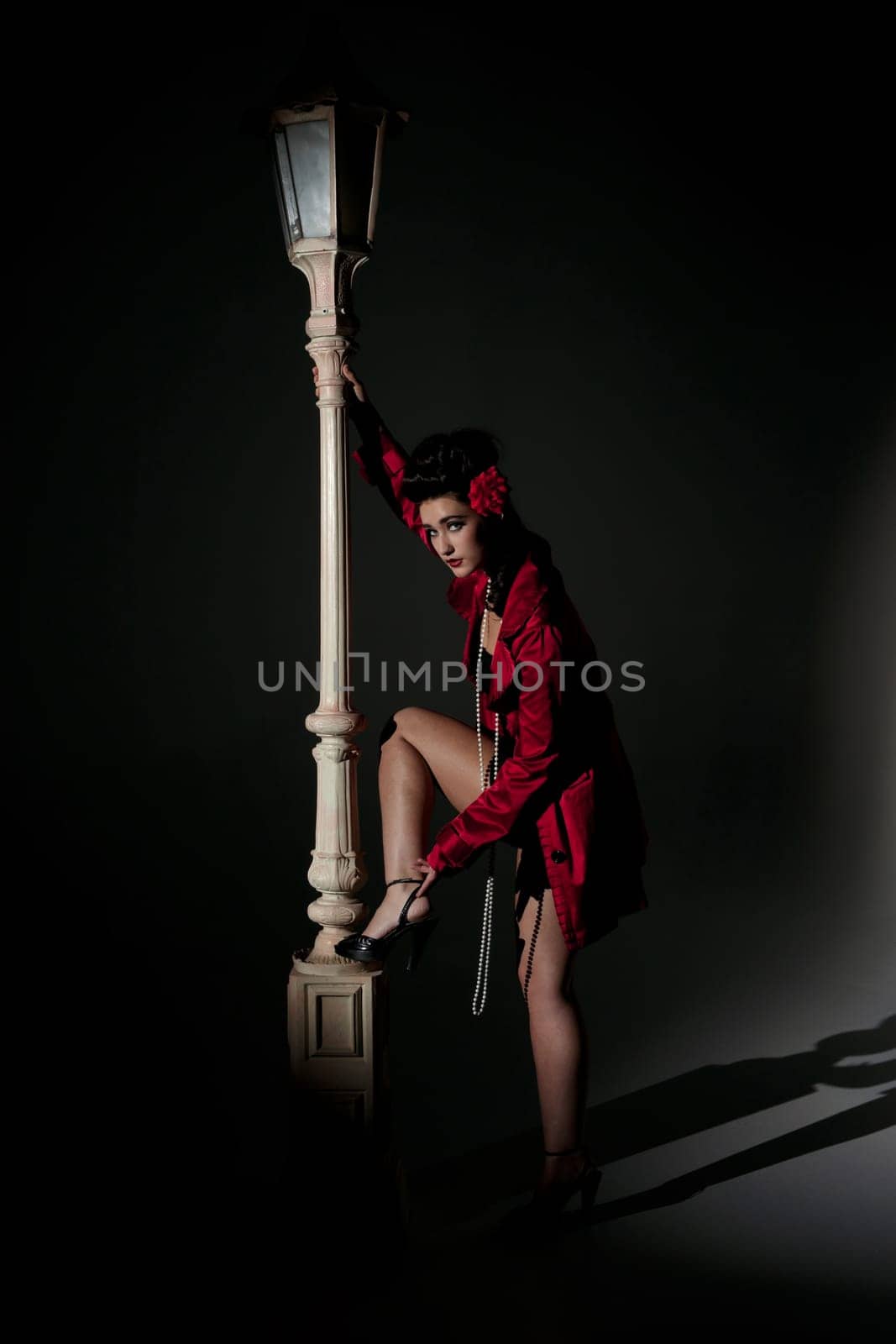 beautiful young glamorous woman  with lightpole