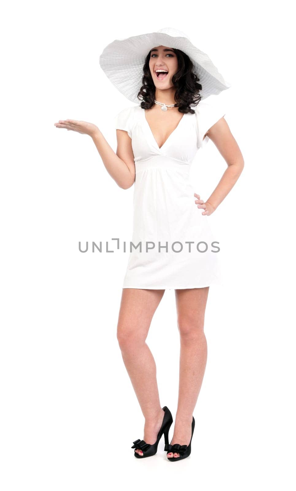beautiful young fashion woman in white dress and hat with hand out