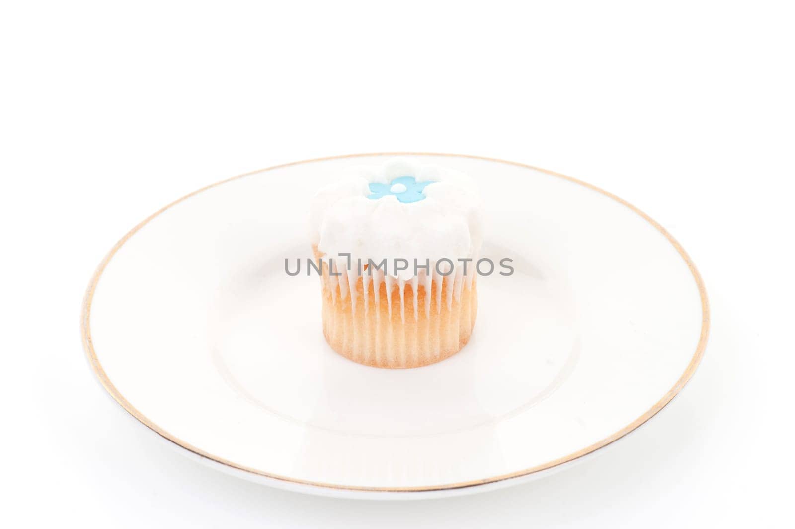 little iced cupcake isolated on white background