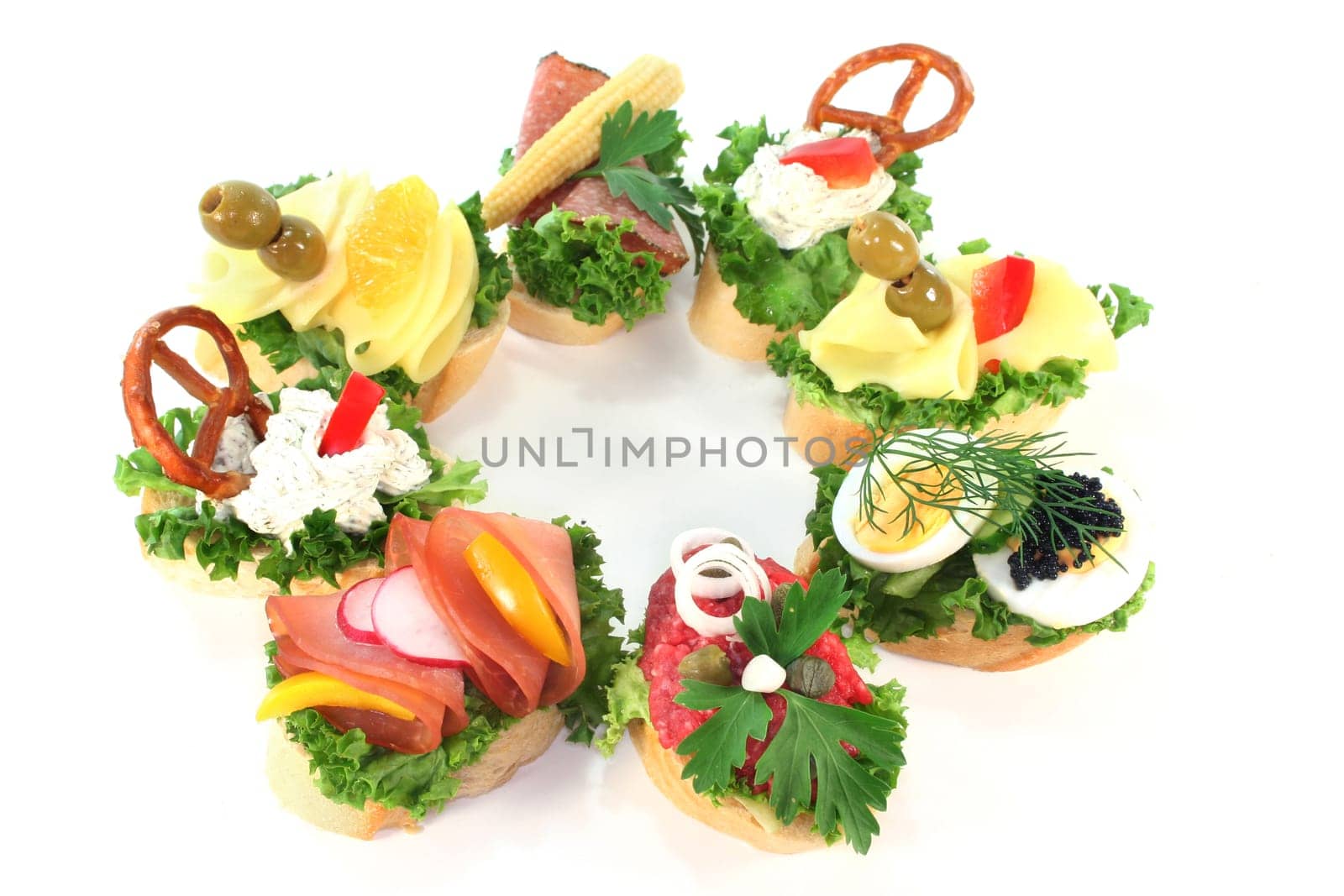 Various canapes against white background