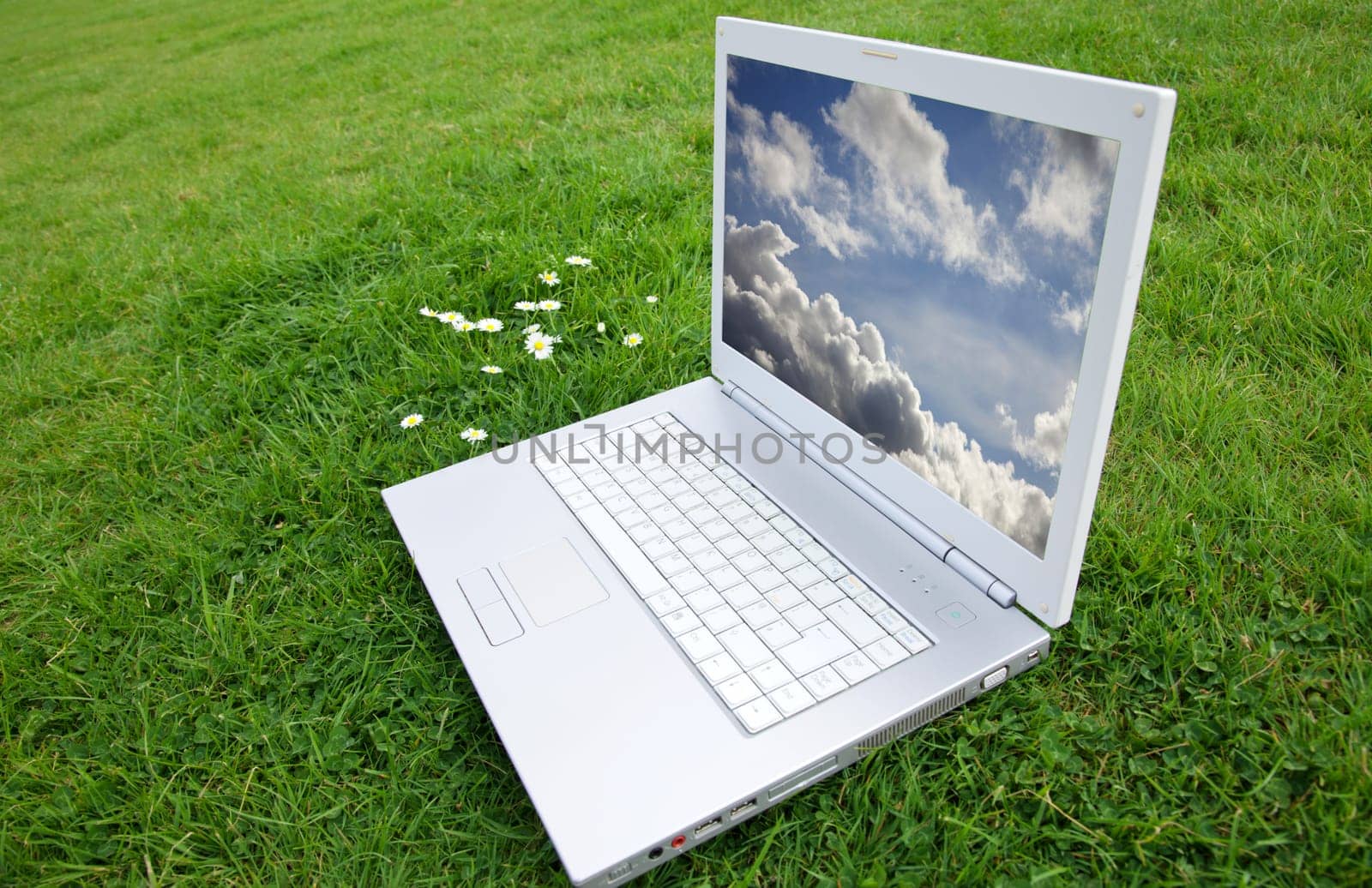New white laptop in park