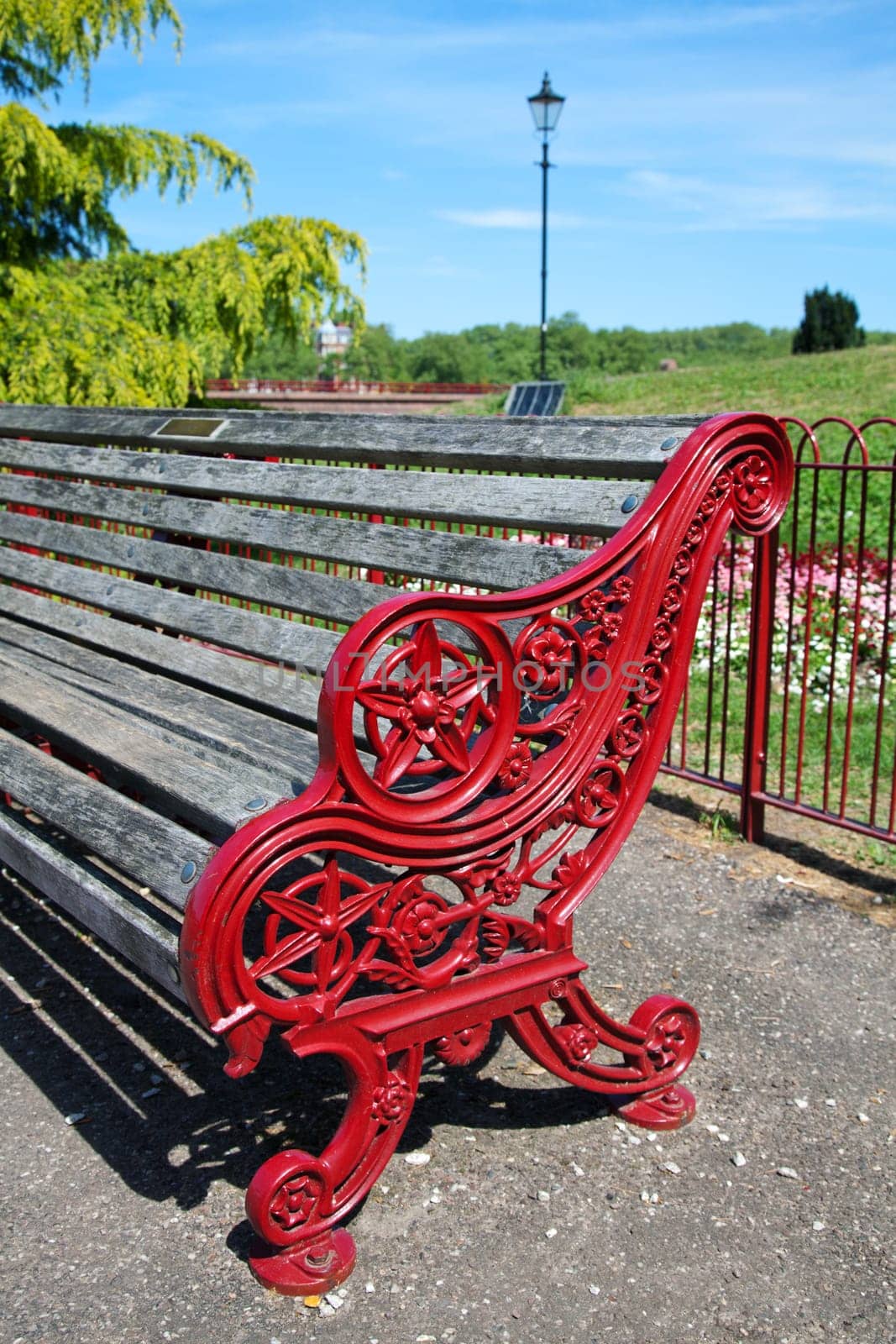 Empty red bench in park