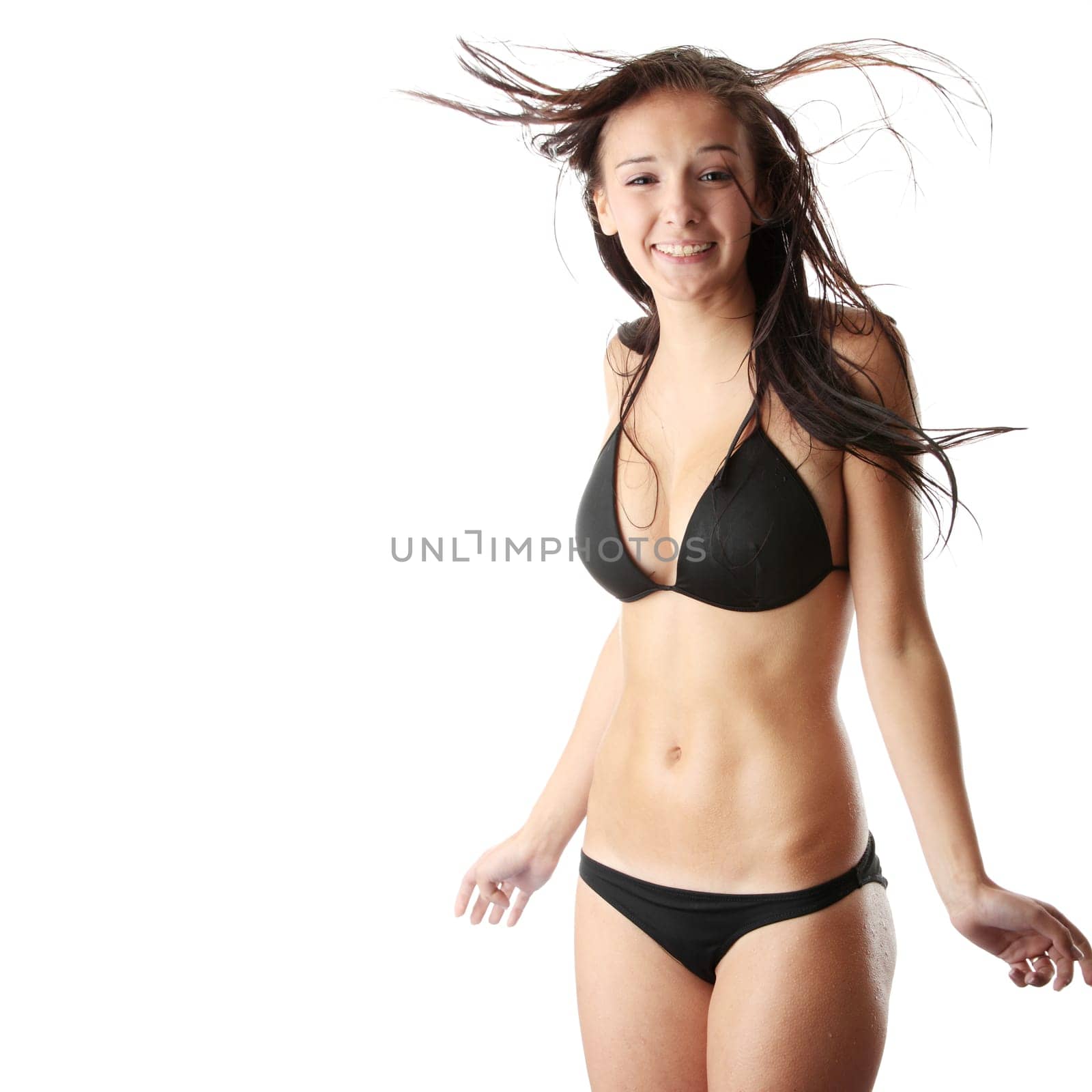 Beautiful wet caucasian woman in black bikini isolated on white background