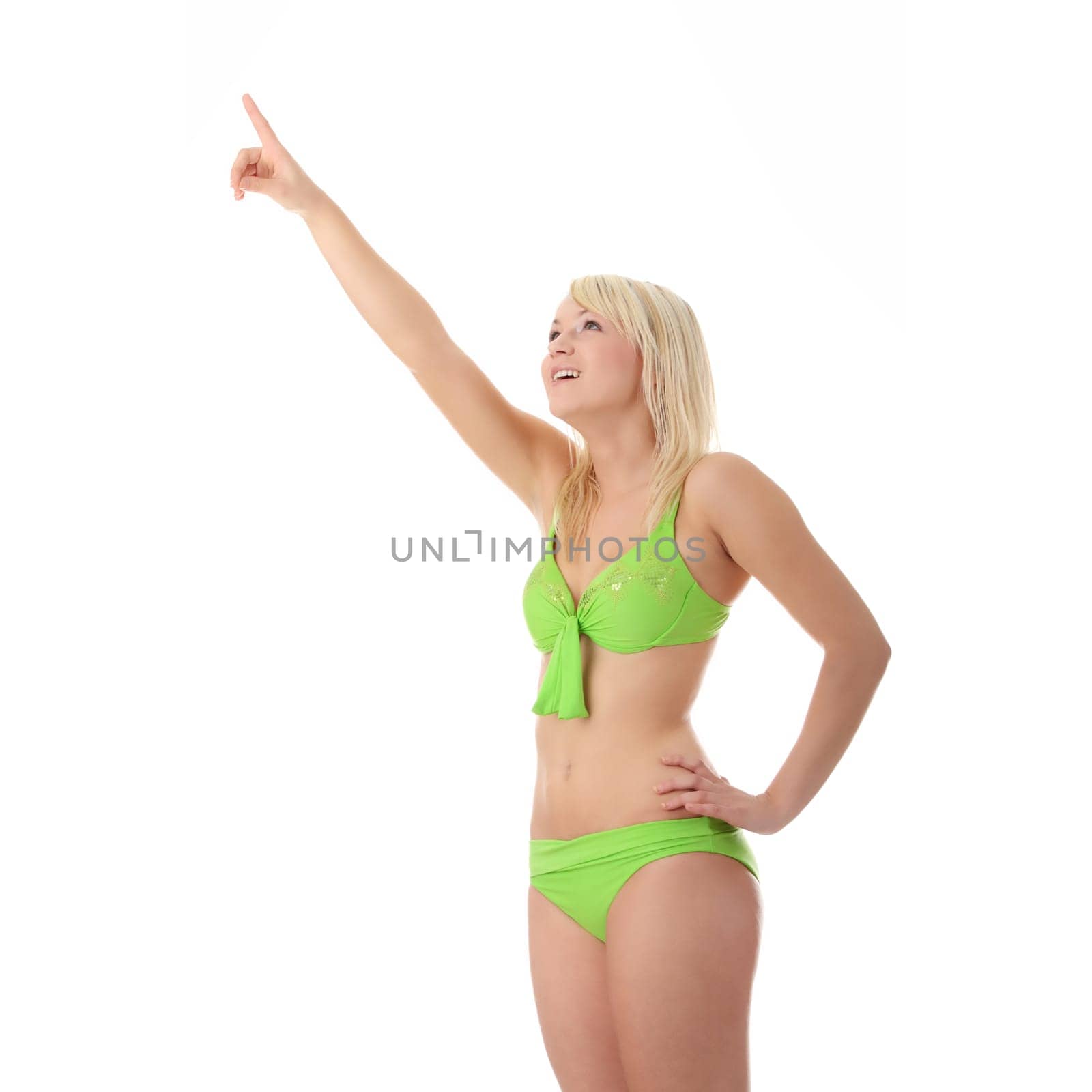 Young woman in green bikini isolated
