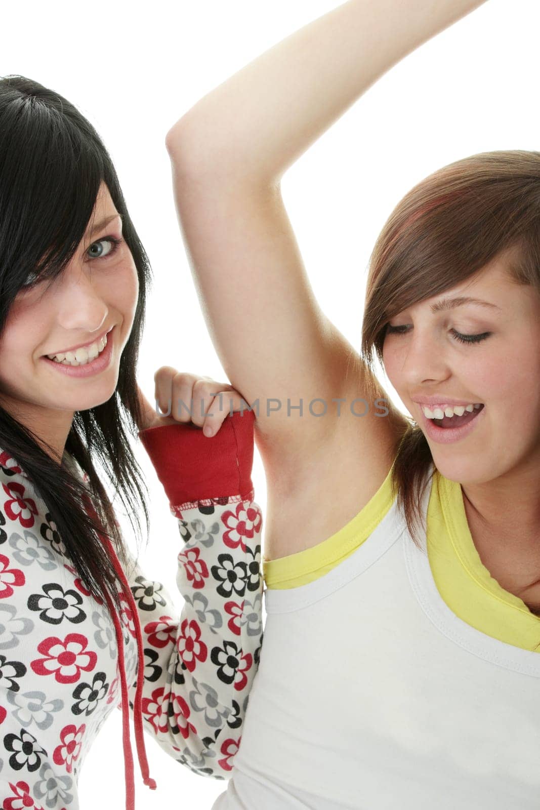 Two teen sisters isolated on white background