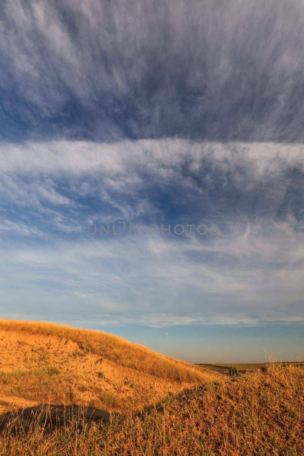 autumn hill and a blue sky with clouds