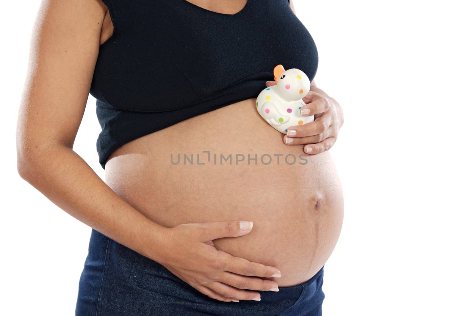 Pregnant woman playing with spotted toy duck