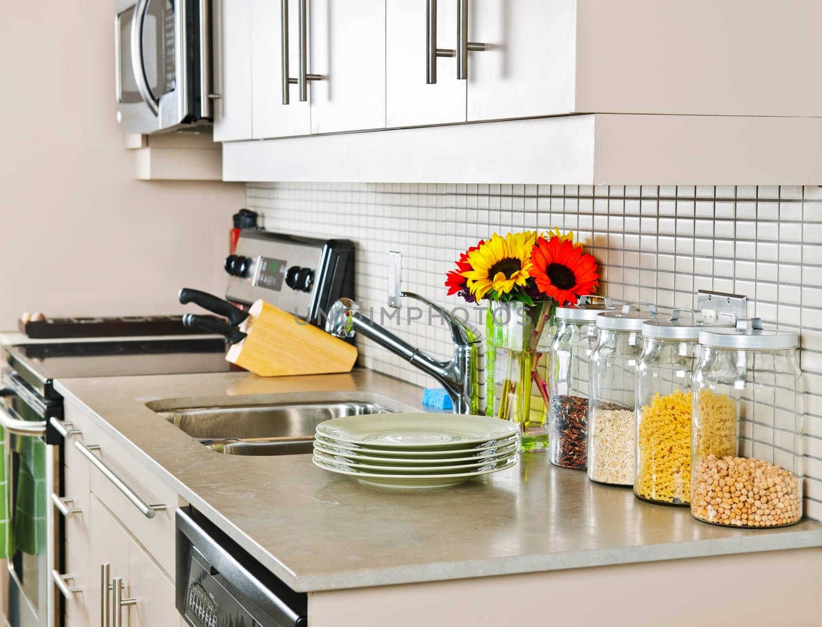Modern small kitchen interior with natural stone countertop