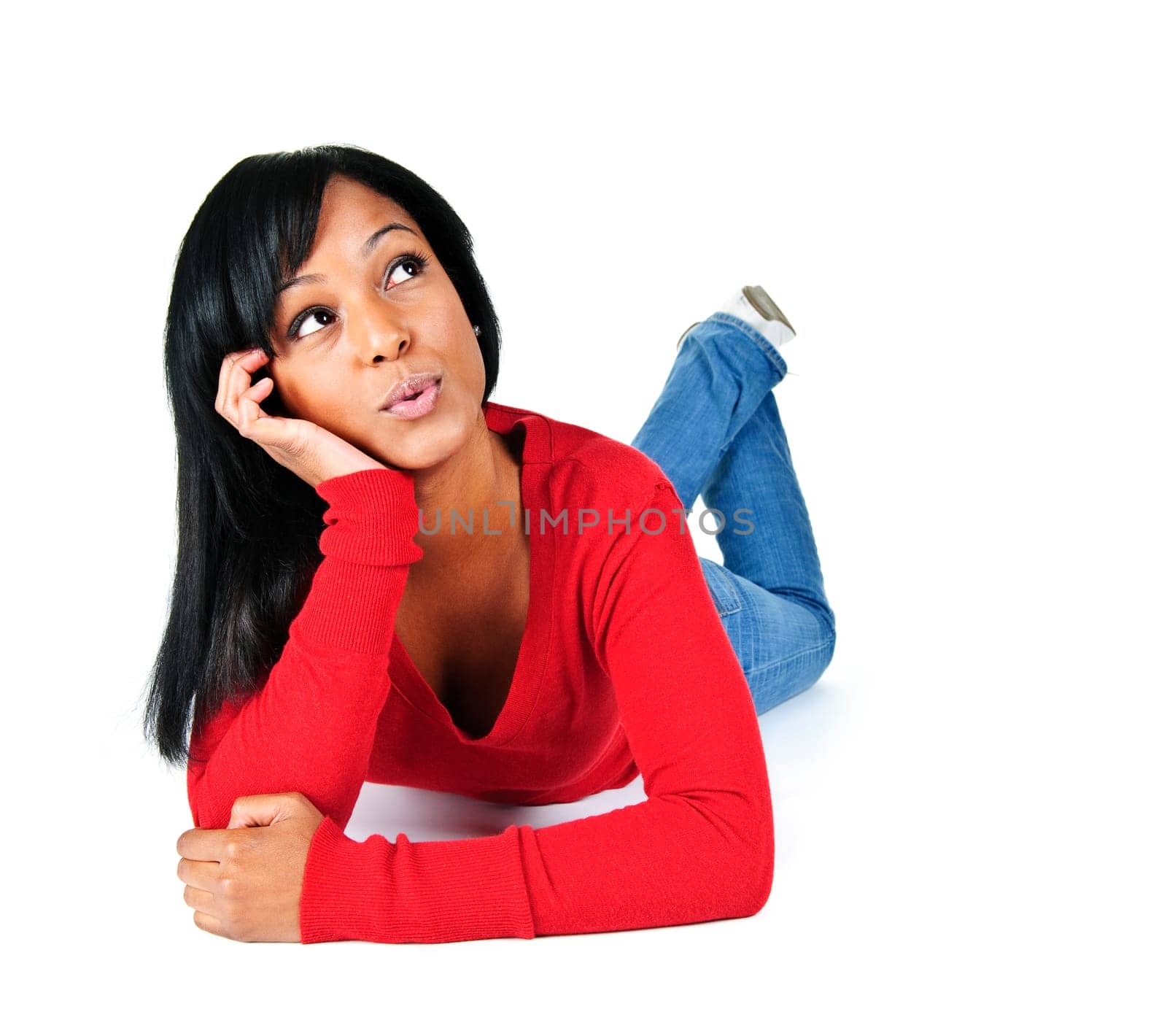 Portrait of black woman looking up and laying on white background